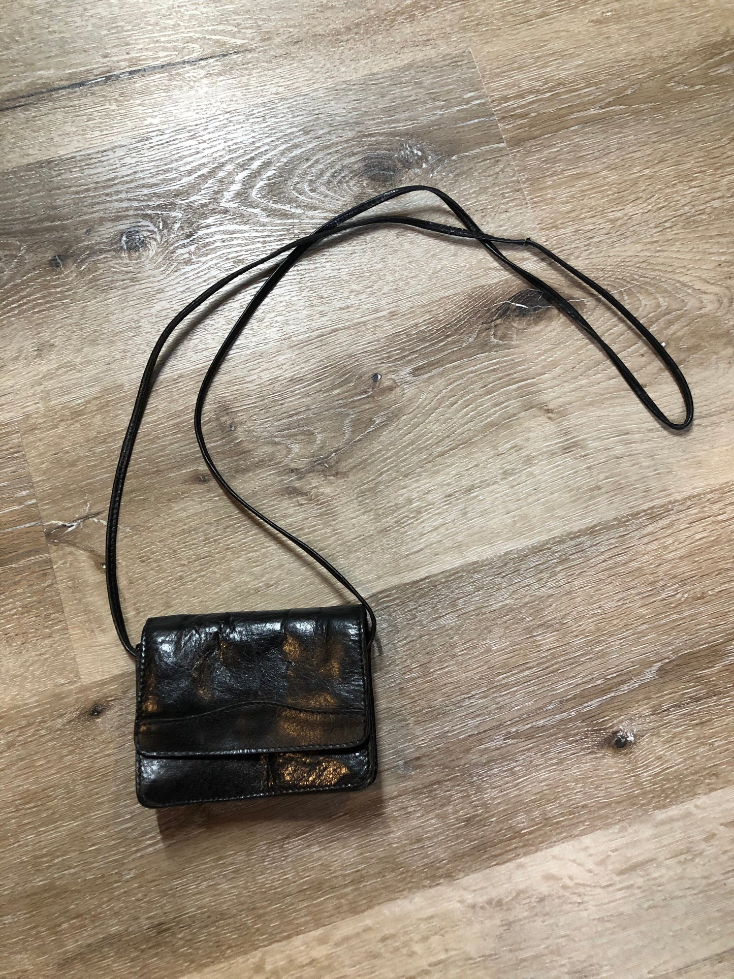 Kingspier Vintage - Small black leather crossbody bag with skinny strap, snap closure, loop to attach to a belt and a paisley lining.