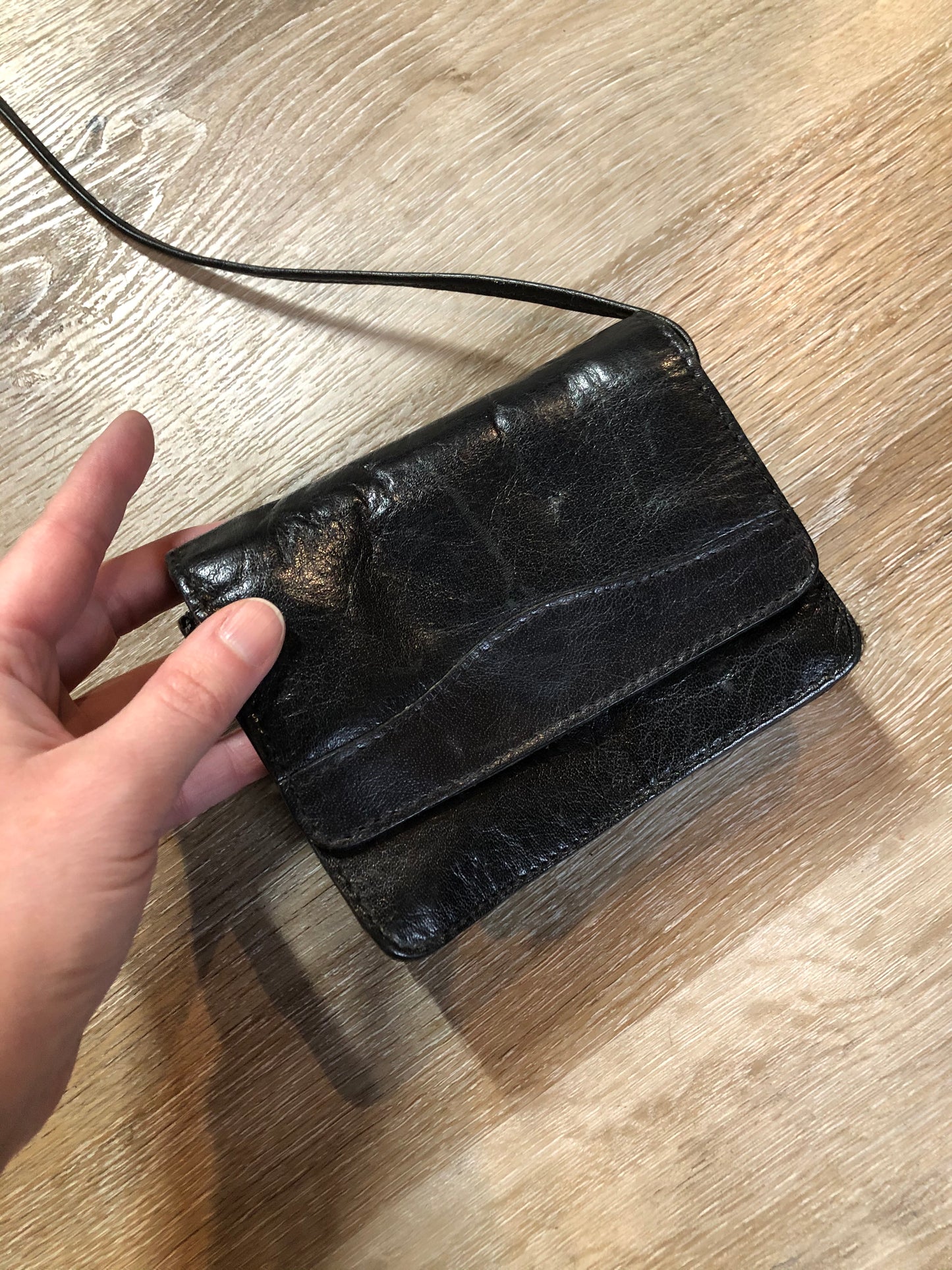 Kingspier Vintage - Small black leather crossbody bag with skinny strap, snap closure, loop to attach to a belt and a paisley lining.