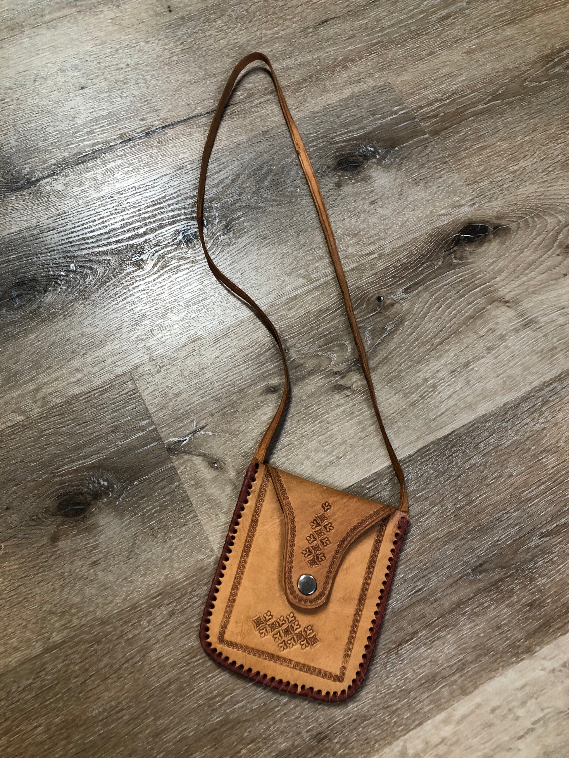Kingspier Vintage - Small tan leather crossbody pouch with snap front closure, leather stitching and decorative tooling.