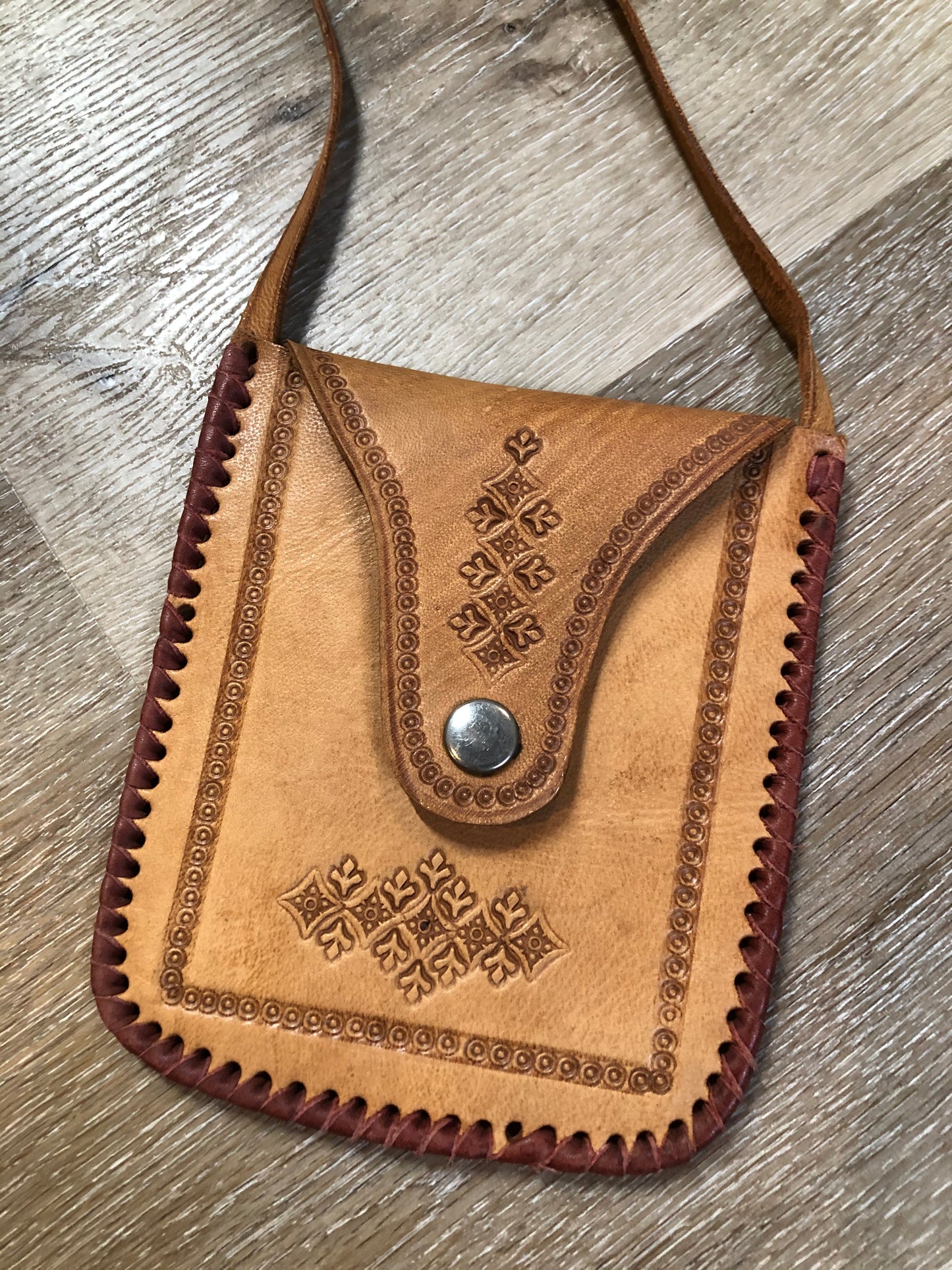 Kingspier Vintage - Small tan leather crossbody pouch with snap front closure, leather stitching and decorative tooling.