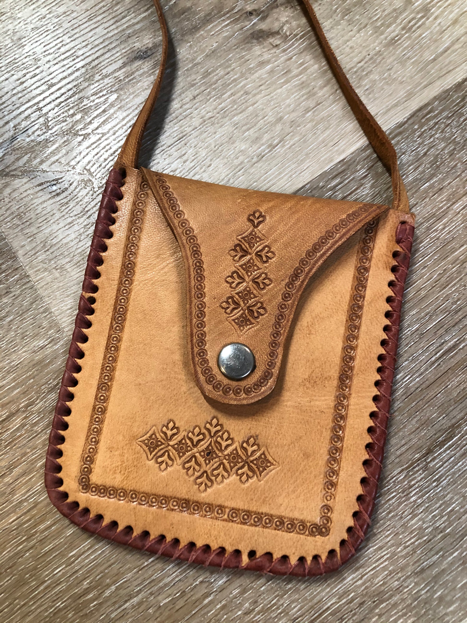 Kingspier Vintage - Small tan leather crossbody pouch with snap front closure, leather stitching and decorative tooling.