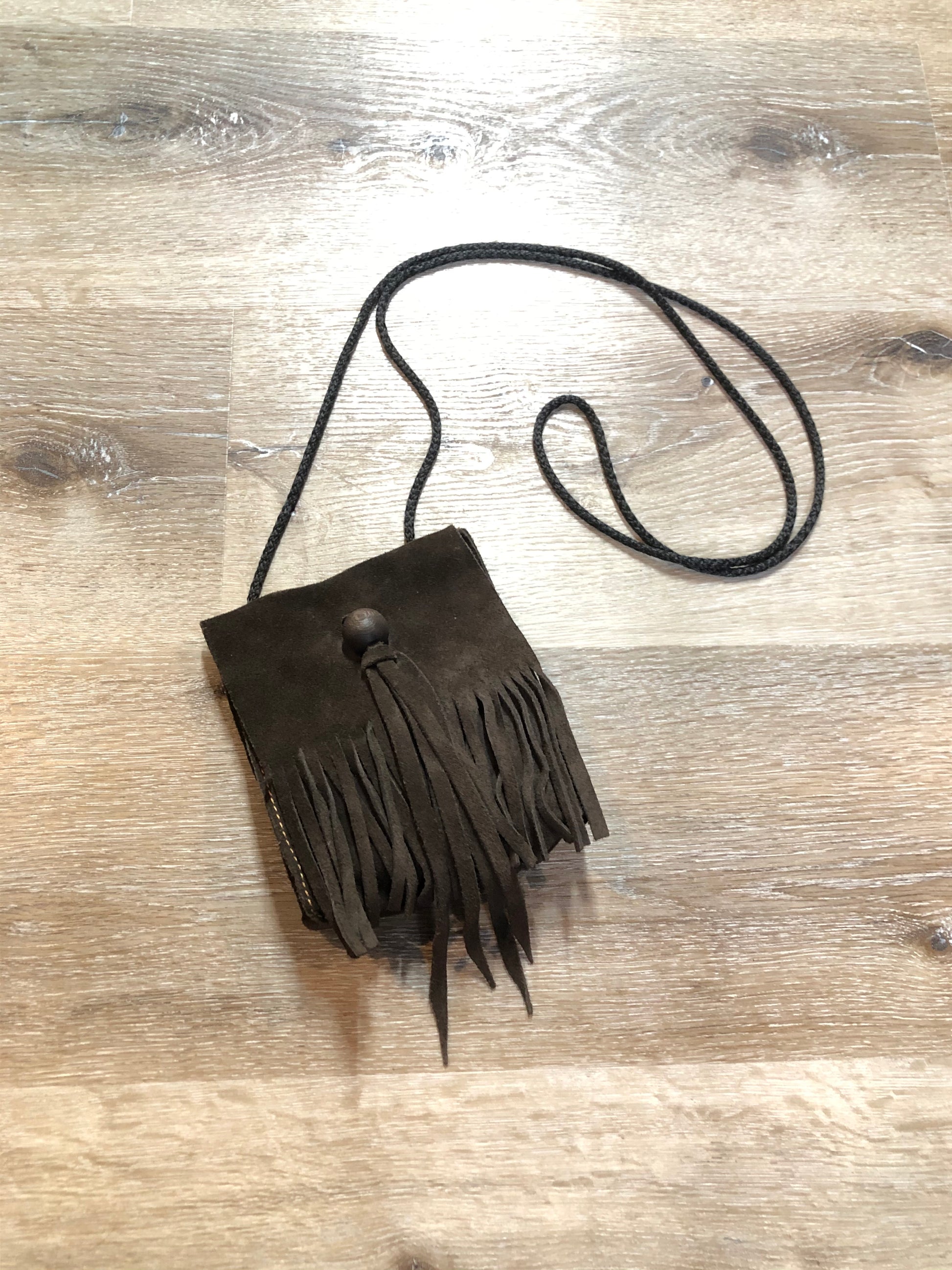 Kingspier Vintage - Small dark brown suede crossbody bag with fringe details.