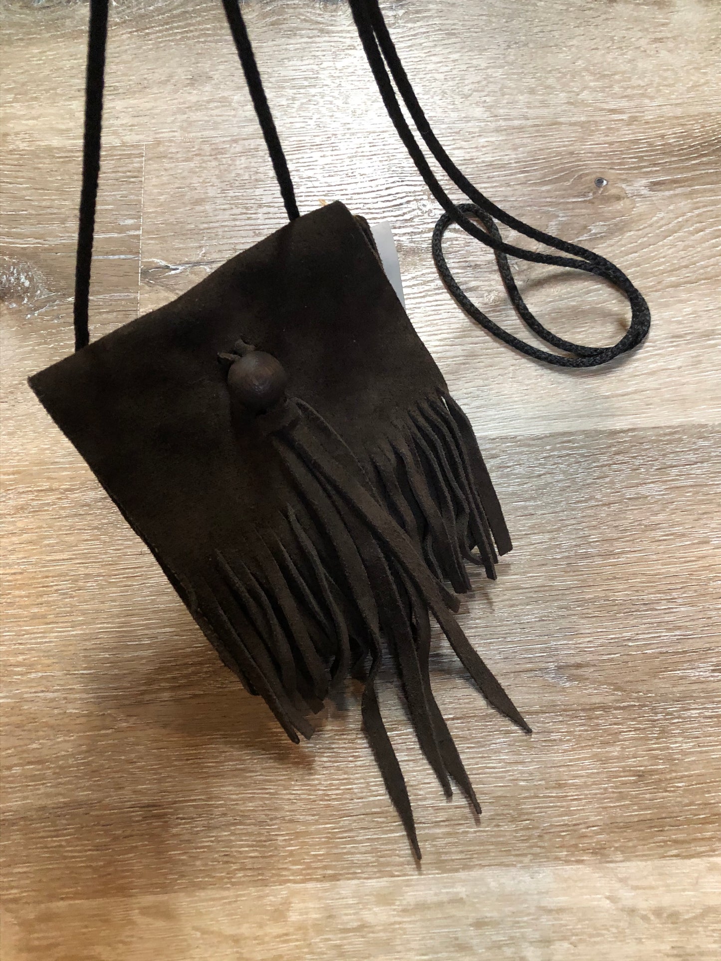 Kingspier Vintage - Small dark brown suede crossbody bag with fringe details.