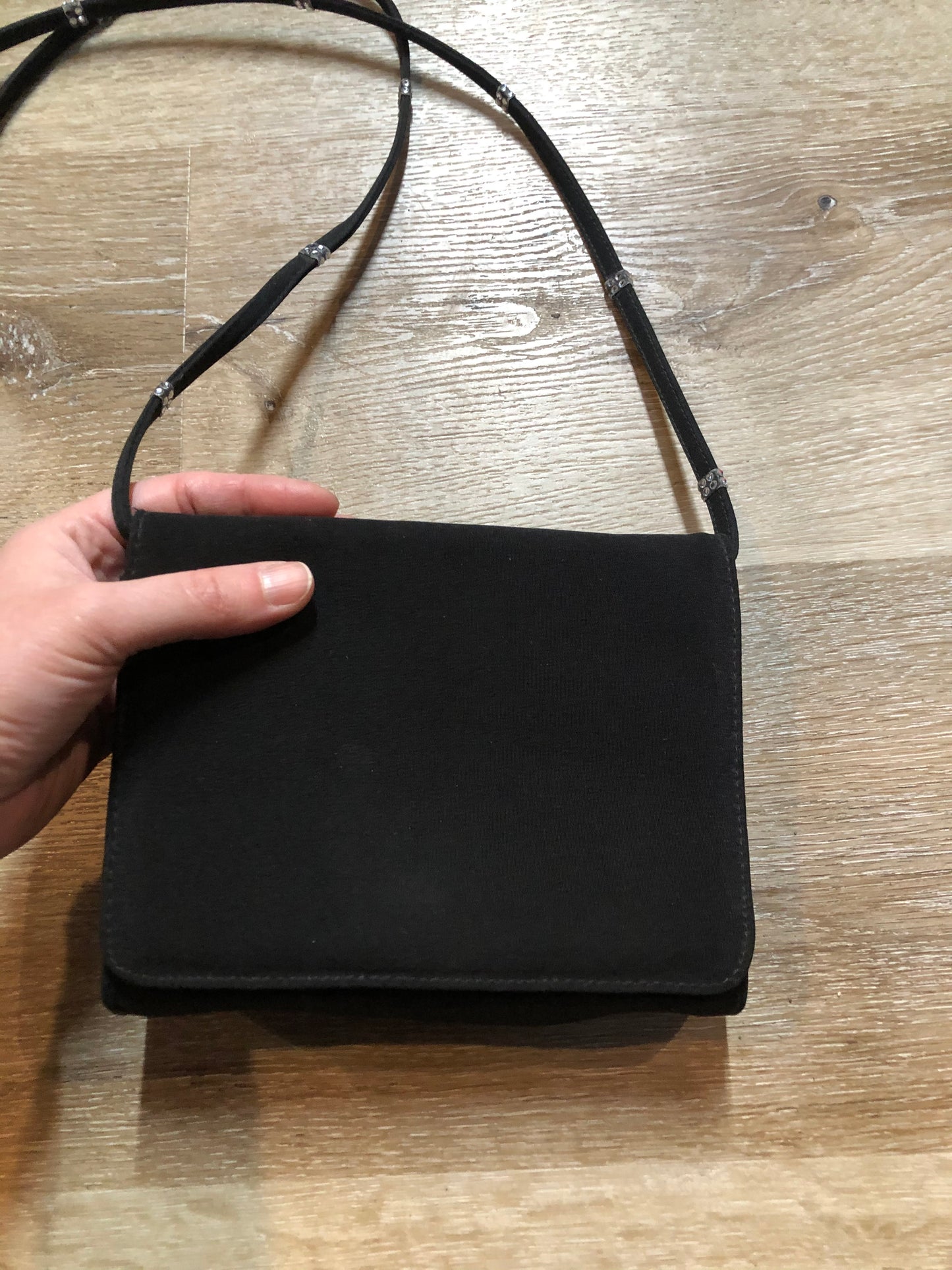 Kingspier Vintage - Stuart Weitzman for Russell and Bromley black crossbody bag with sparkle details on the strap, flap top with snap closure. Fibre content unknown.