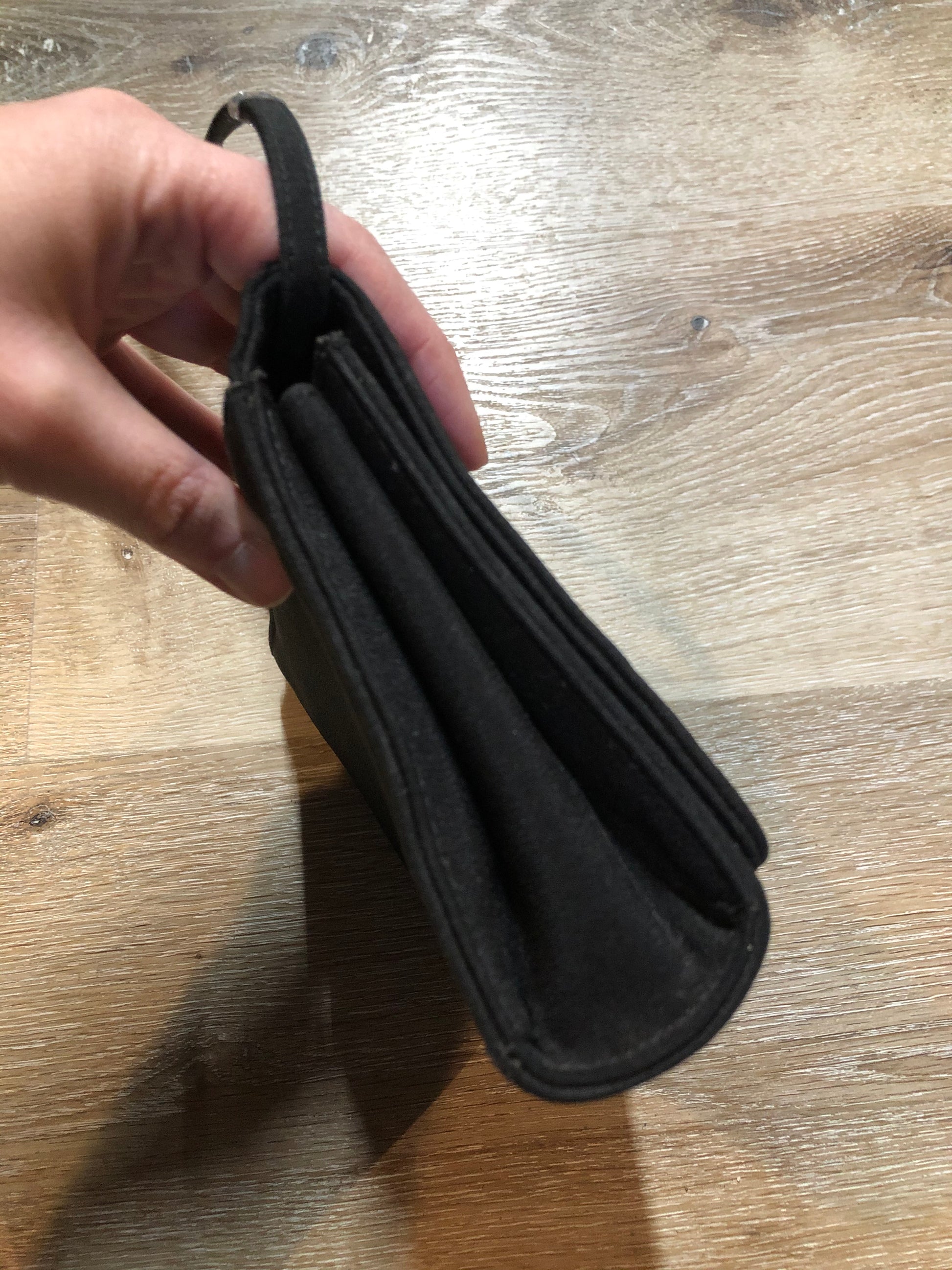 Kingspier Vintage - Stuart Weitzman for Russell and Bromley black crossbody bag with sparkle details on the strap, flap top with snap closure. Fibre content unknown.