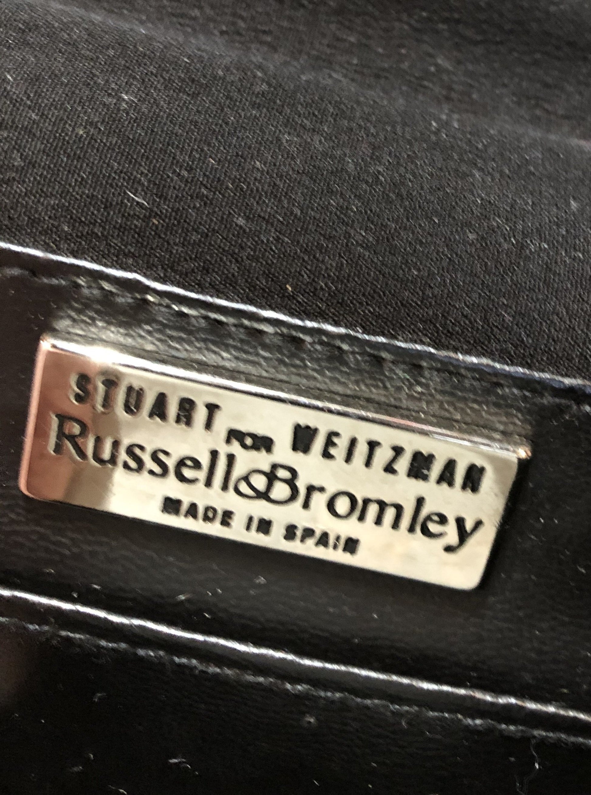 Kingspier Vintage - Stuart Weitzman for Russell and Bromley black crossbody bag with sparkle details on the strap, flap top with snap closure. Fibre content unknown.