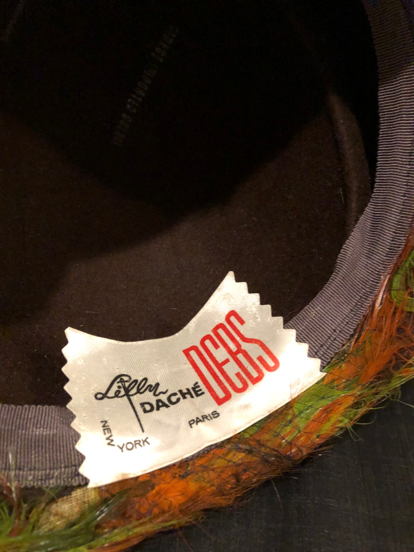 Kingspier Vintage - Lilly Dache Debs brown felt hat with green and orange feathered brim.
Circumference - 21”\
Hat is in excellent vintage condition.