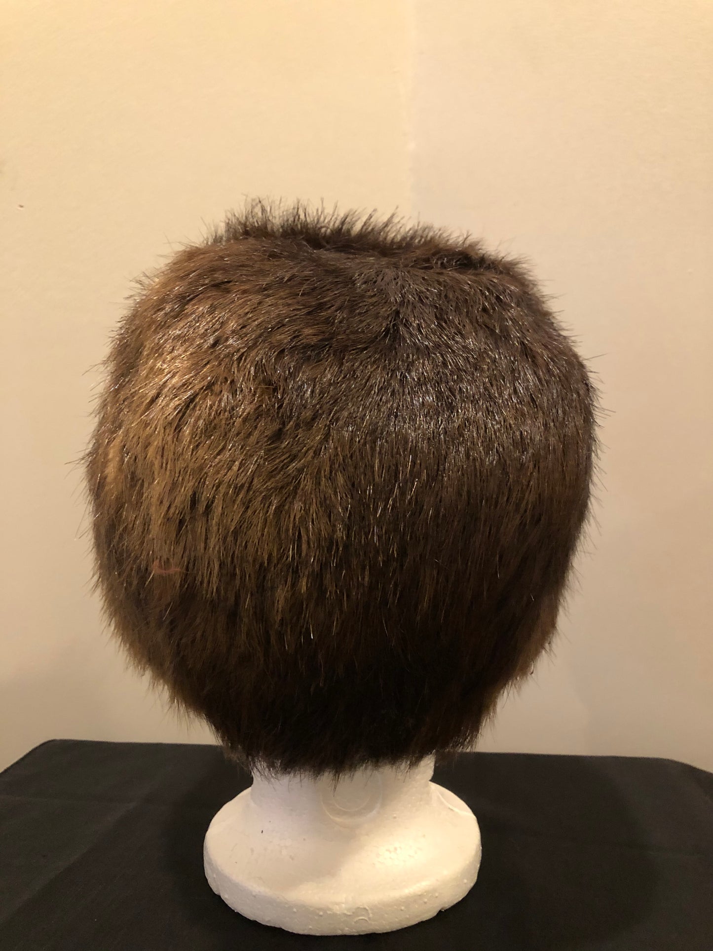 Kingspier Vintage - Dark brown fur hat with front flap and quilted lining.
Circumference - 21.5”
Hat is in good condition with some overall wear.