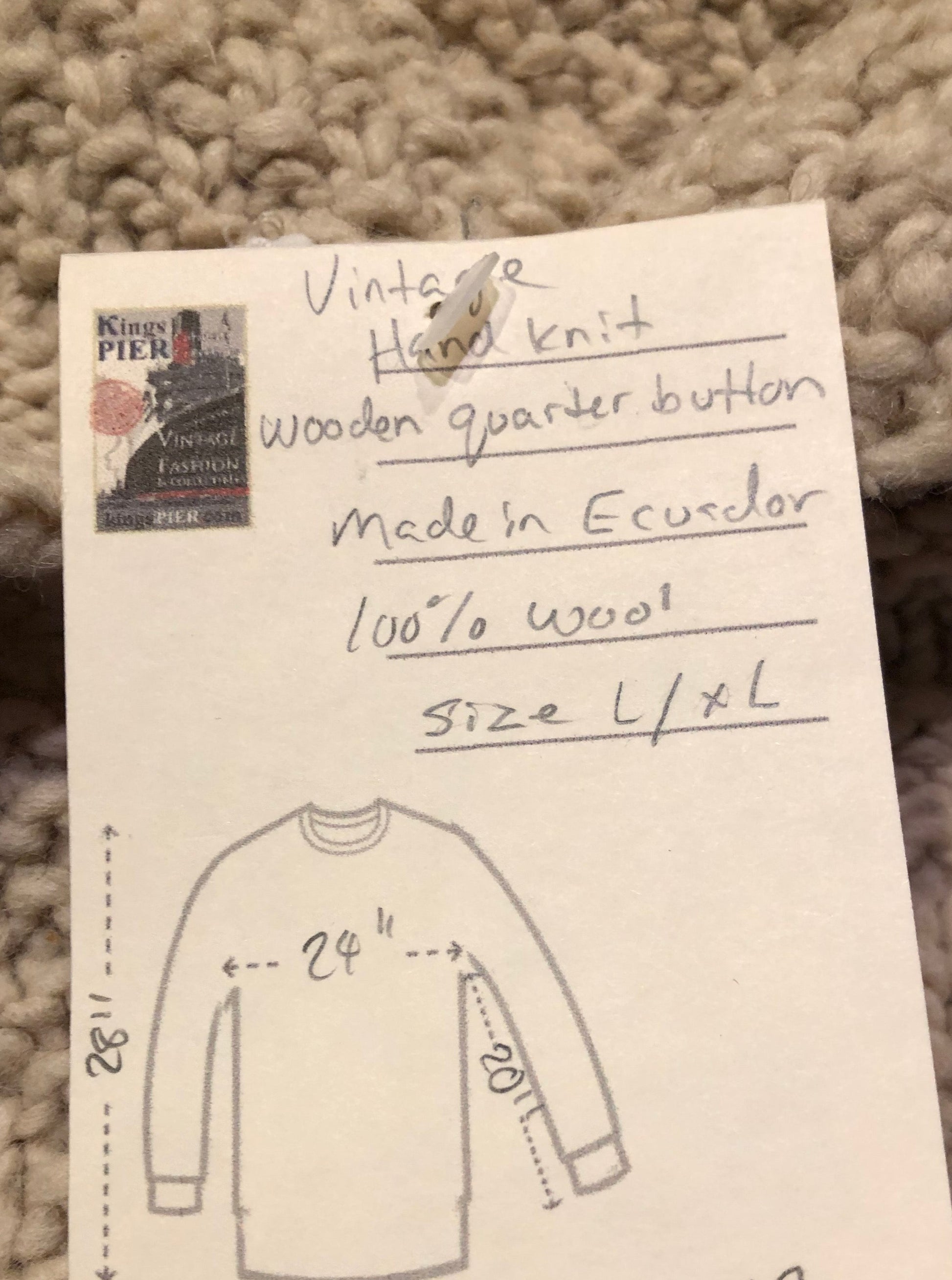 Kingspier Vintage - Vintage 100% wool quarter button pullover sweater featuring wooden buttons.
Made in Ecuador.
Size large.XL.