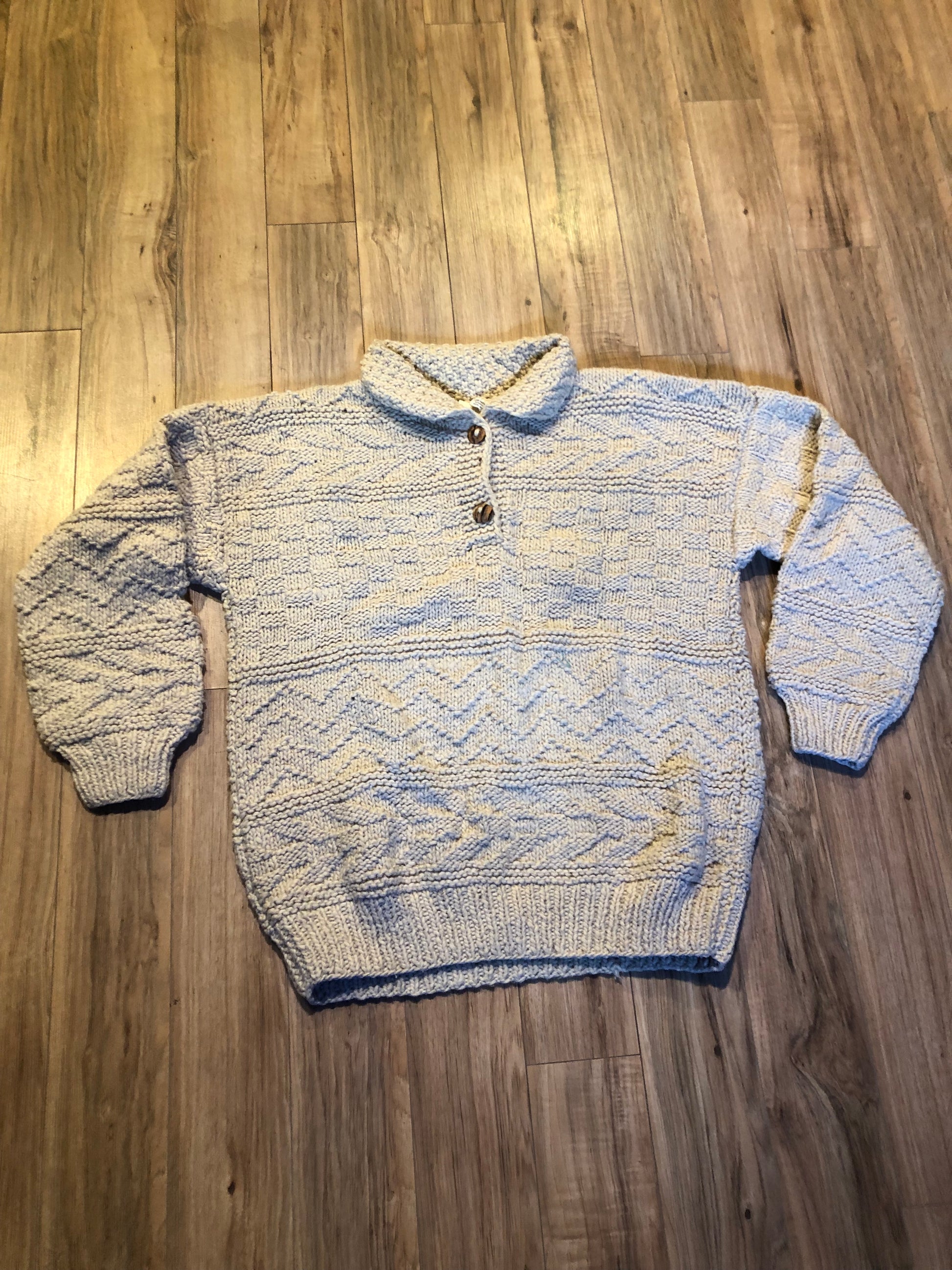 Kingspier Vintage - Vintage 100% wool quarter button pullover sweater featuring wooden buttons.
Made in Ecuador.
Size large.XL.