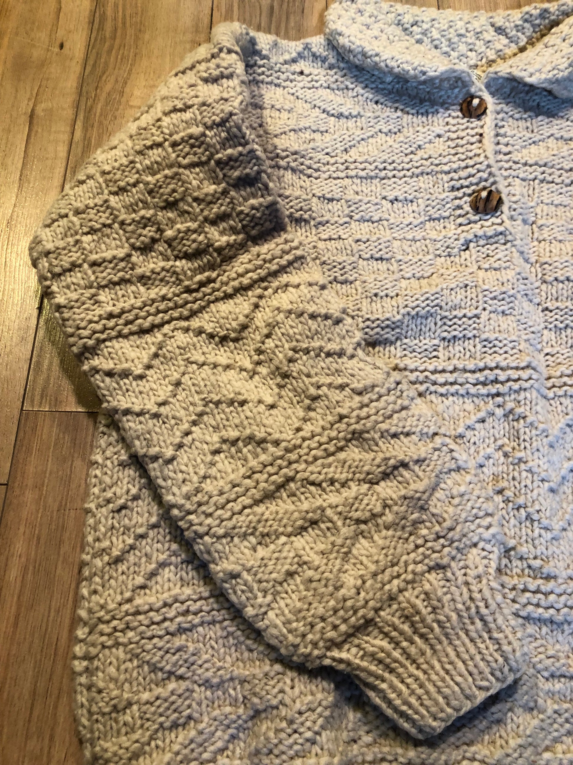 Kingspier Vintage - Vintage 100% wool quarter button pullover sweater featuring wooden buttons.
Made in Ecuador.
Size large.XL.