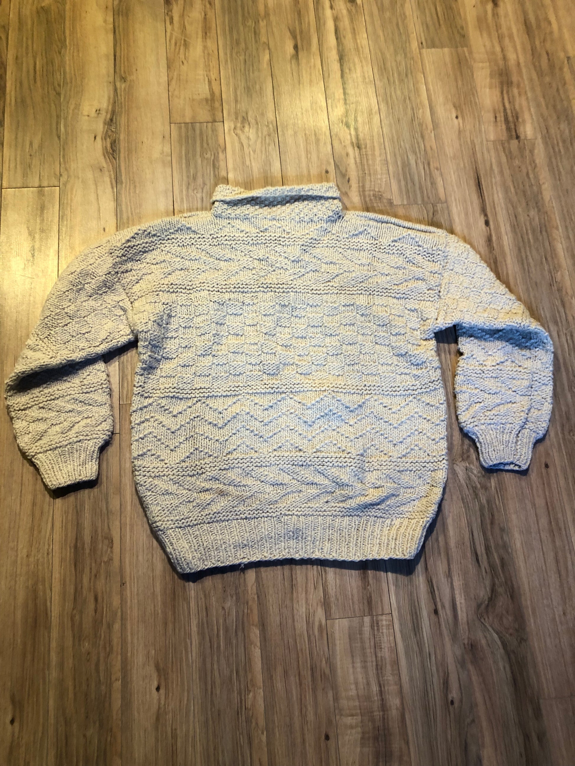 Kingspier Vintage - Vintage 100% wool quarter button pullover sweater featuring wooden buttons.
Made in Ecuador.
Size large.XL.