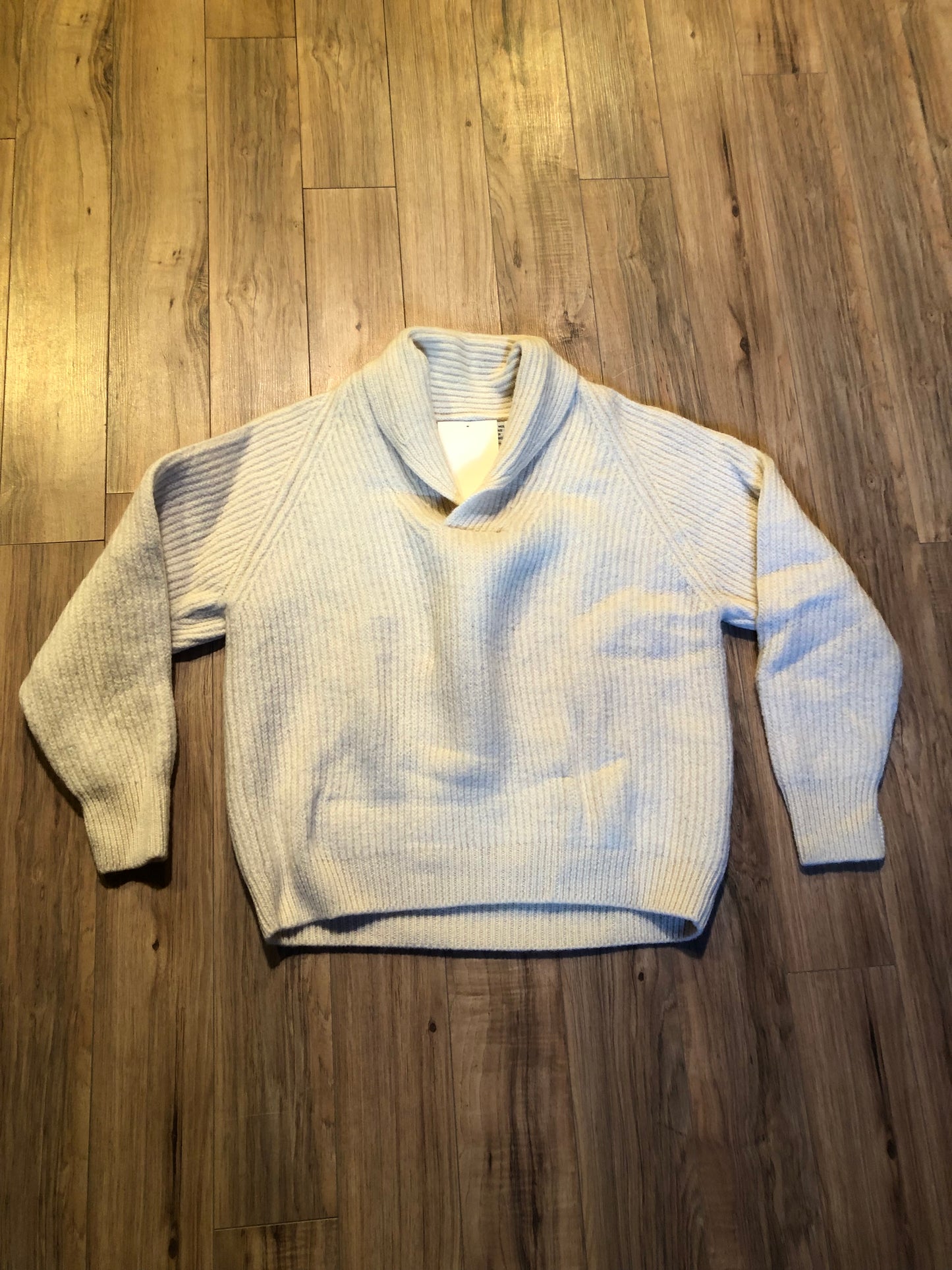 Kingspier Vintage - Vintage Wind River Outfitting Co.
Cream coloured 100% wool sweater with rib knit stitch and shawl collar.
Made in Canada.
Size large.