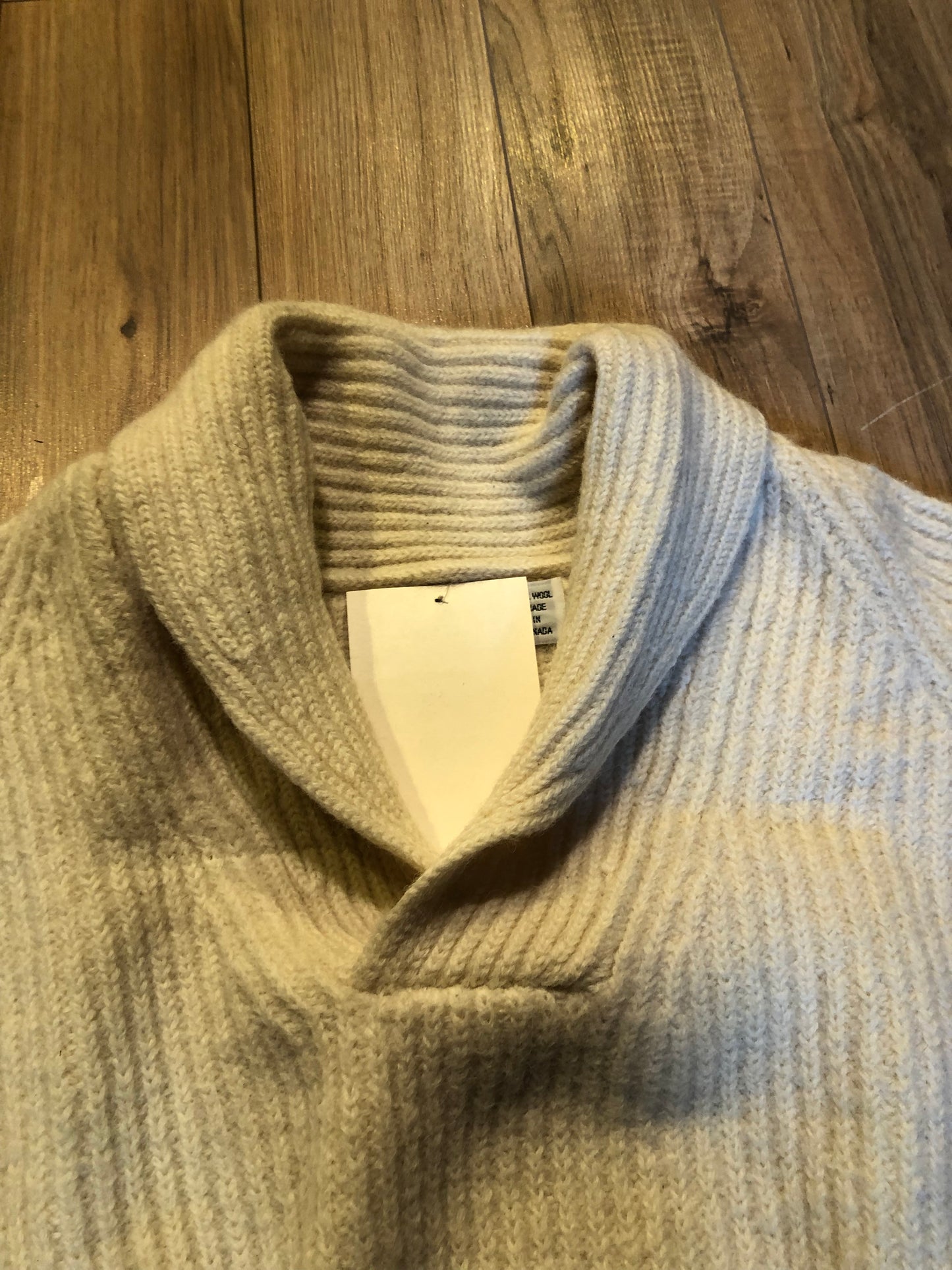 Kingspier Vintage - Vintage Wind River Outfitting Co.
Cream coloured 100% wool sweater with rib knit stitch and shawl collar.
Made in Canada.
Size large.