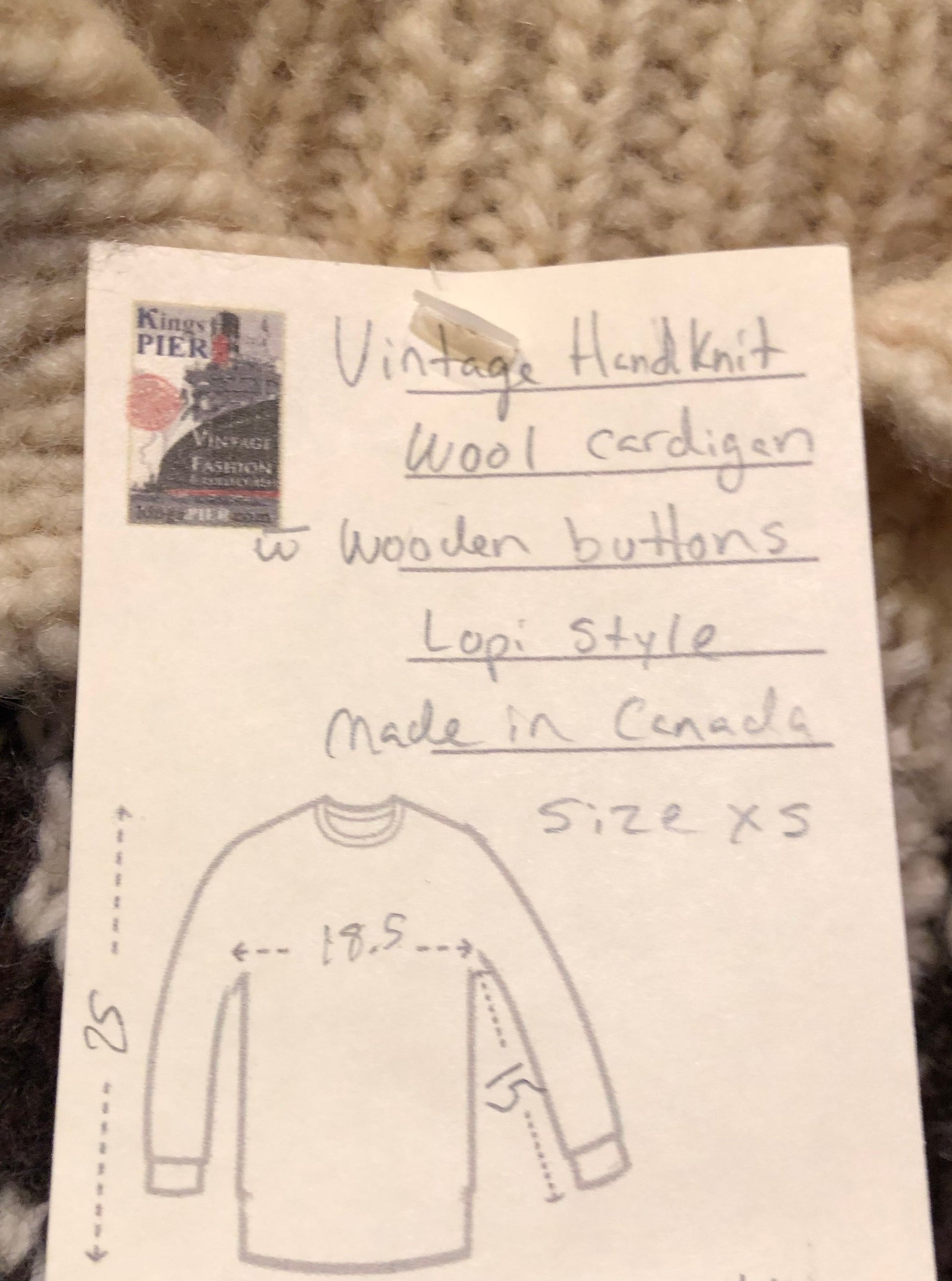 Kingspier Vintage - Vintage hand-knit wool Lopi style cardigan with wooden buttons.
Made in Canada.
Size XS.