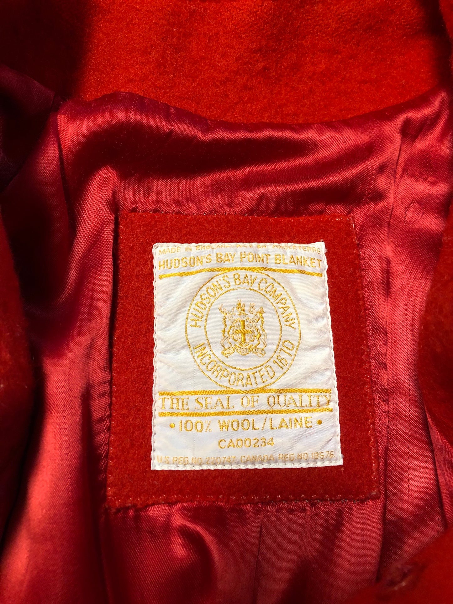Kingspier Vintage - Hudson’s Bay Company red and black stripe 100% virgin wool point blanket coat in a swing coat style with belt, buckle detail at the collar, button closures, slash pockets and red lining. Size medium/ large.