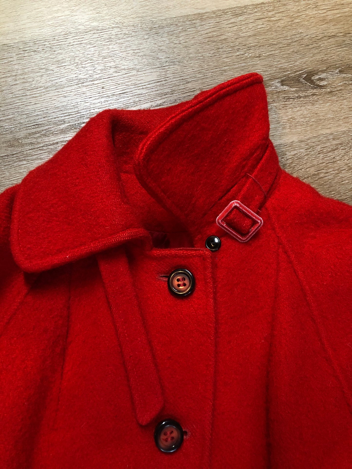 Kingspier Vintage - Hudson’s Bay Company red and black stripe 100% virgin wool point blanket coat in a swing coat style with belt, buckle detail at the collar, button closures, slash pockets and red lining. Size medium/ large.
