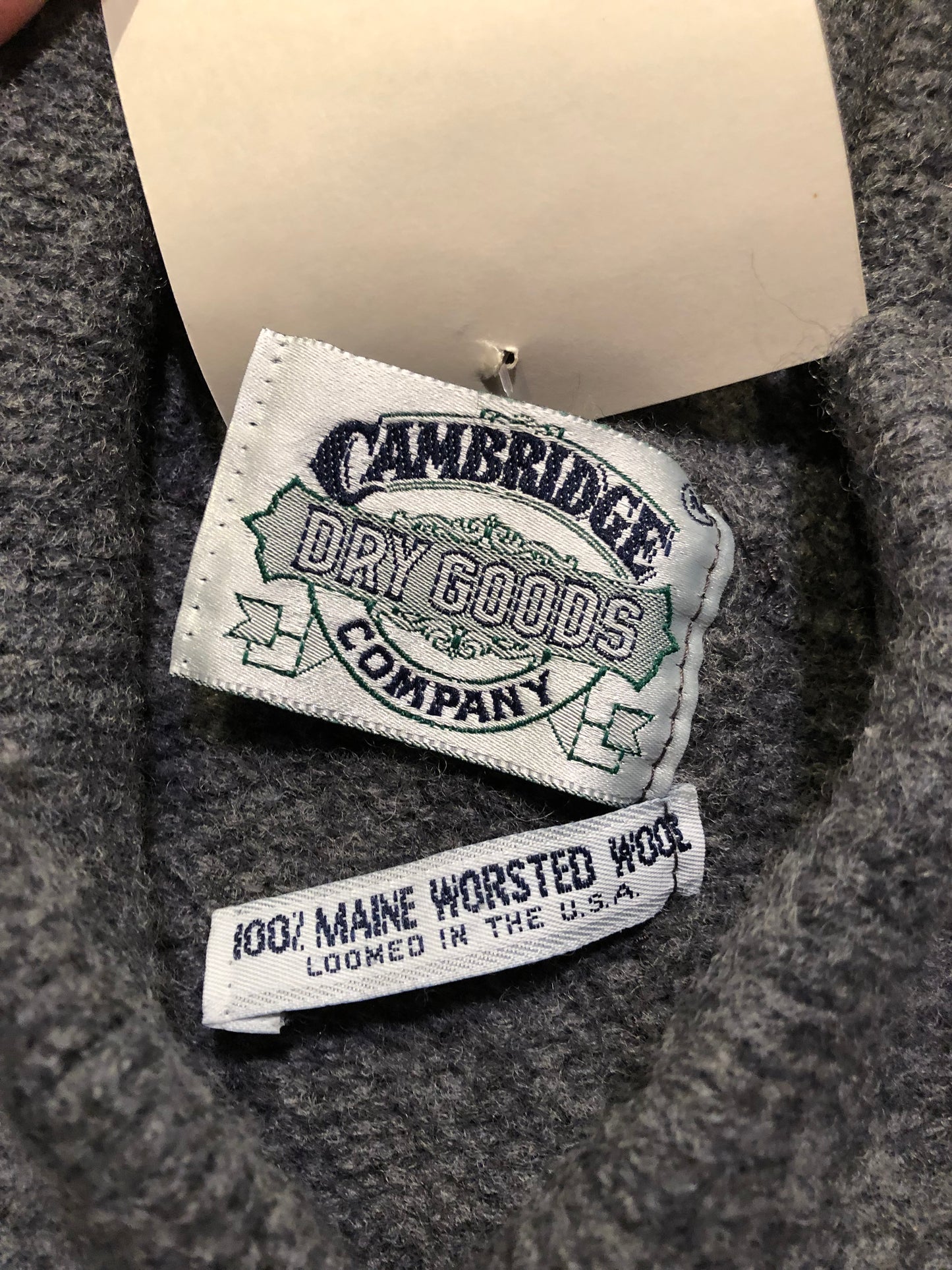 Kingspier Vintage - Vintage Cambridge Dry Goods 100% grey wool pullover sweater with one button.
Wool is worsted in Maine and loomed in USA.
Size small.