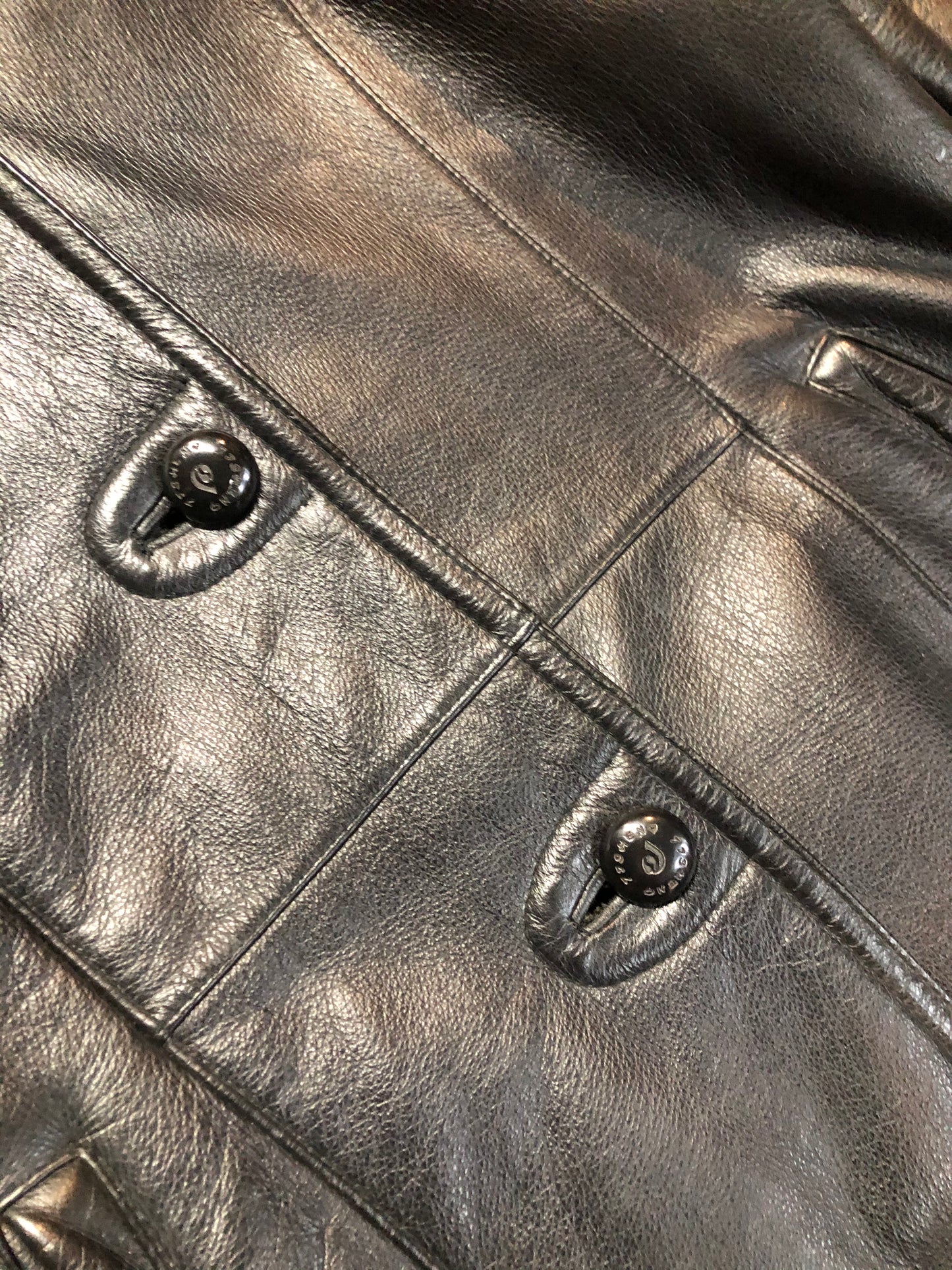 Kingspier Vintage - Contemporary black leather flight style jacket with synthetic wool pile lining , button closures and slash pockets.