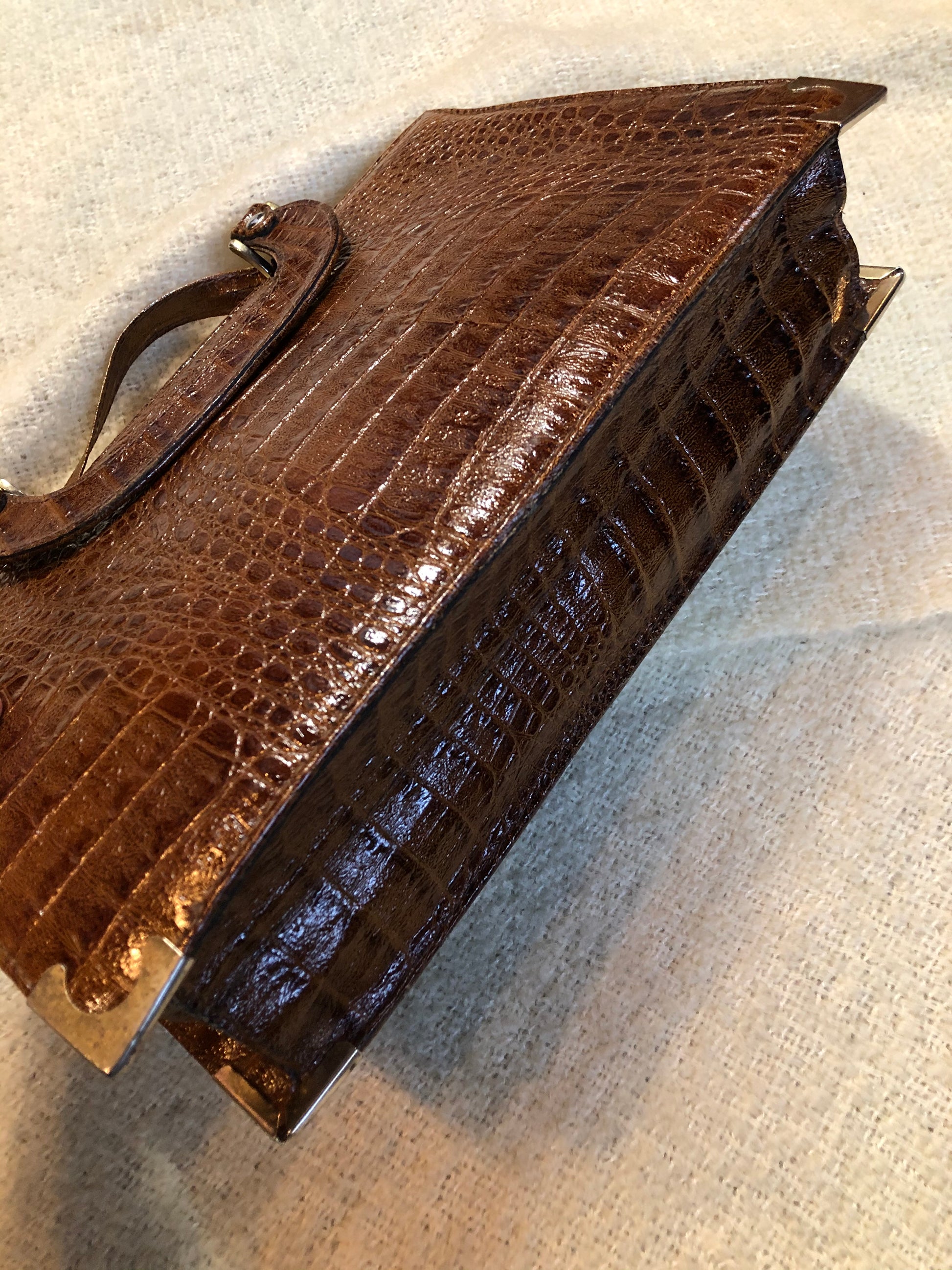 Kingspier Vintage - Vintage Veneto reptile skin satchel with front pocket, removable shoulder strap and two large inside compartments. Made in Italy.
Length - 14”
Width - 3.5”
Height - 9”
Strap - 33”
This purse is in excellent condition.