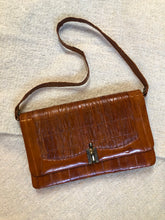Load image into Gallery viewer, Kingspier Vintage - Vintage satchel in very soft caramel colour leather with gathered leather details, a unique front clasp, brass hardware and three inside compartments. 

Length - 12”
Width - 1”
Height - 7.5”
Strap - 30.5”

This purse is in excellent condition.
