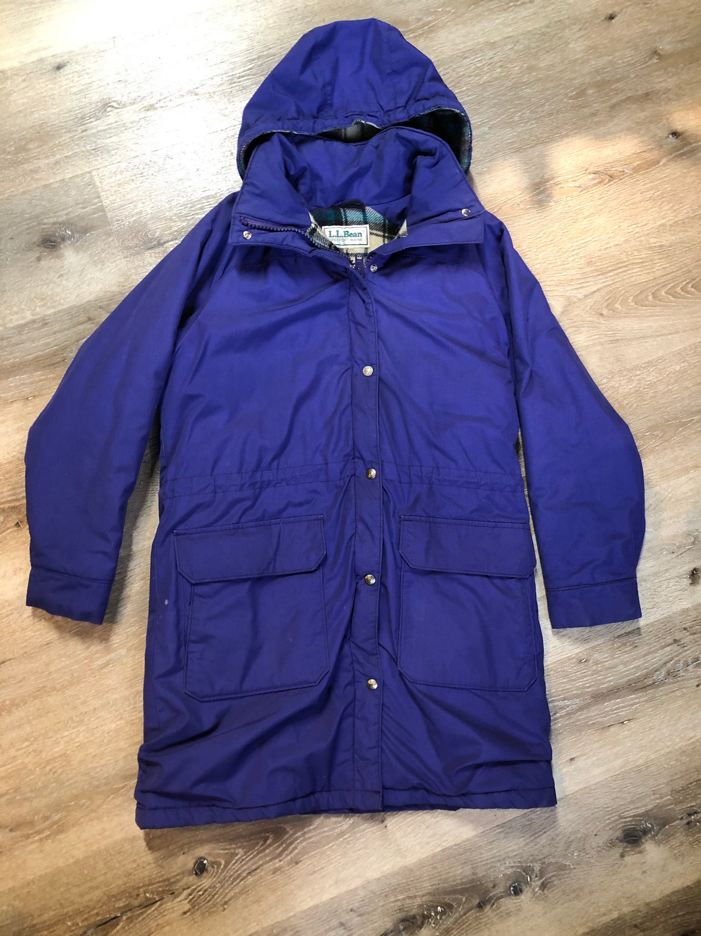 Kingspier Vintage - LL Bean purple casual coat with plaid lining, snap and zip closures, flap pockets, drawstring at the waist and detachable hood. Size medium.