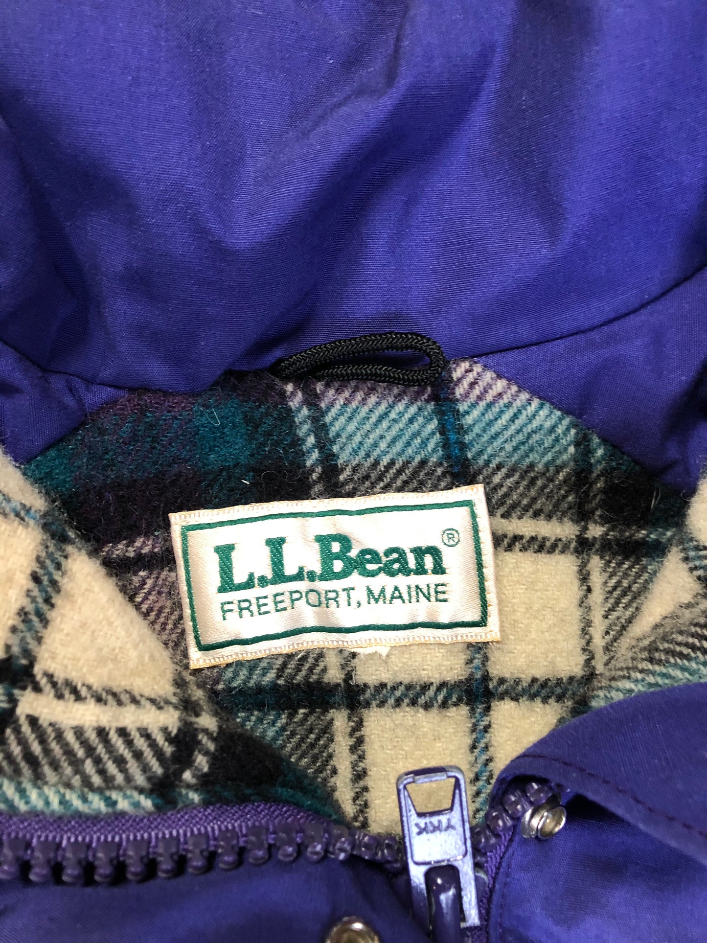 Kingspier Vintage - LL Bean purple casual coat with plaid lining, snap and zip closures, flap pockets, drawstring at the waist and detachable hood. Size medium.