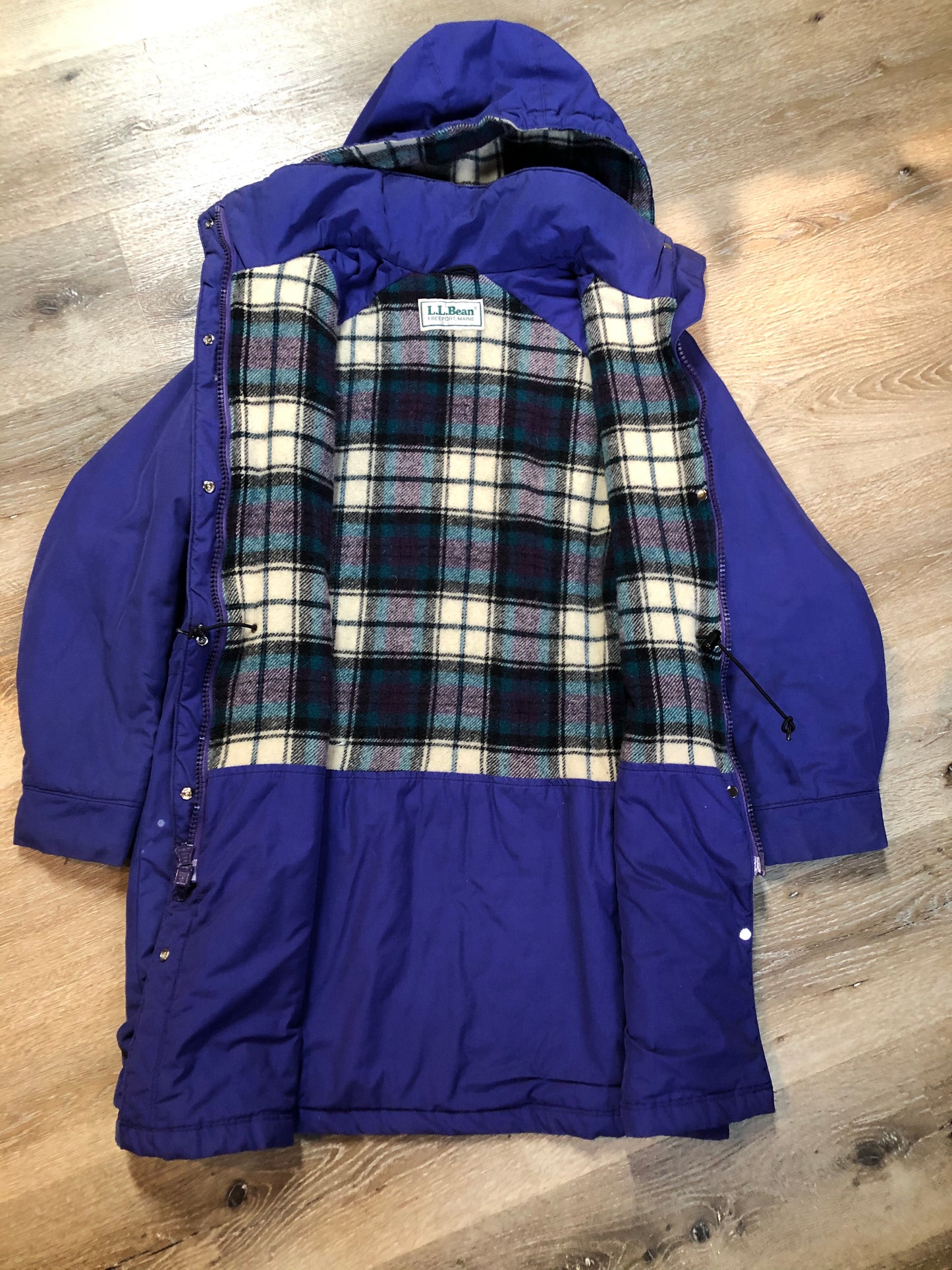 Kingspier Vintage - LL Bean purple casual coat with plaid lining, snap and zip closures, flap pockets, drawstring at the waist and detachable hood. Size medium.