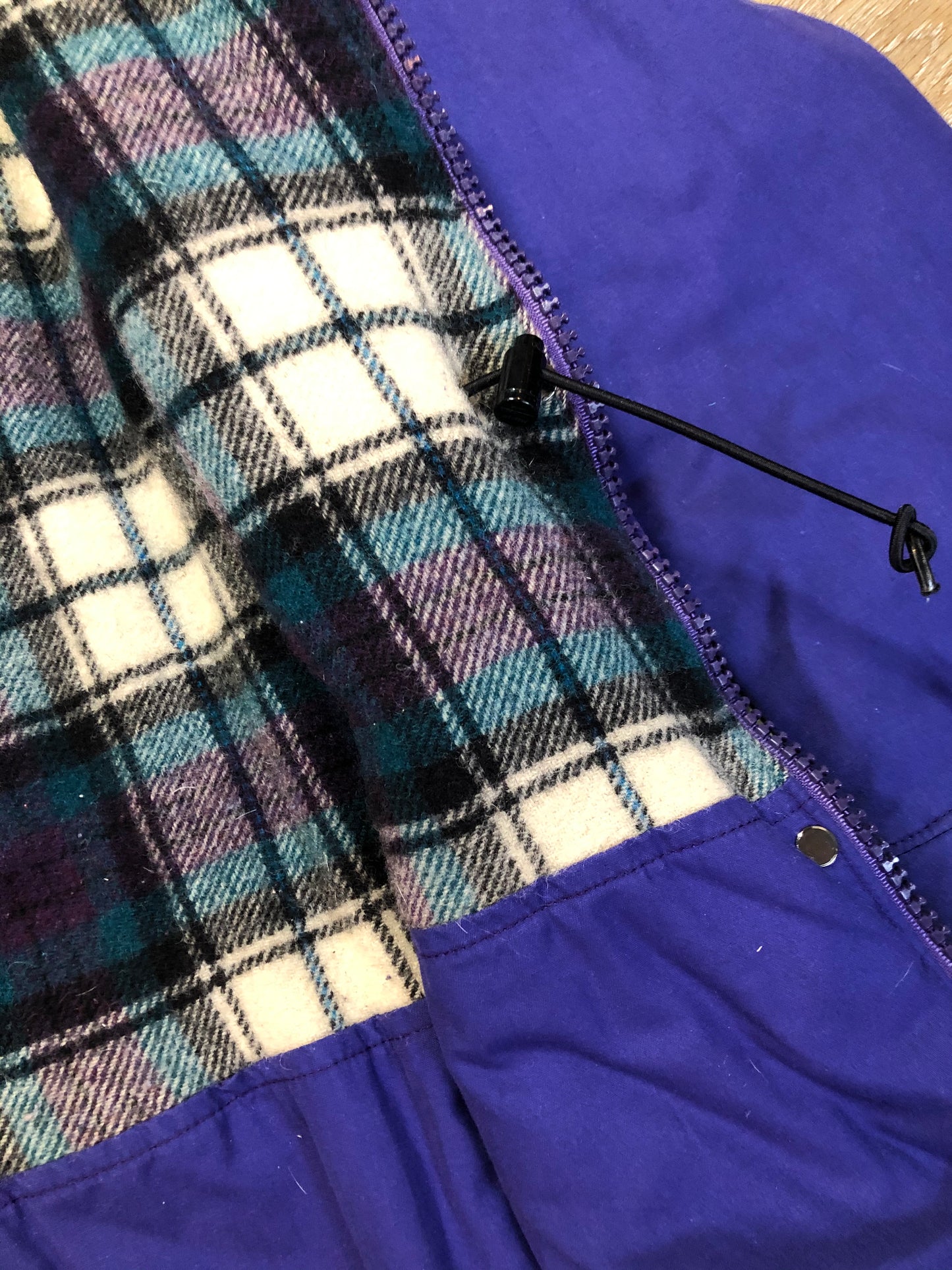Kingspier Vintage - LL Bean purple casual coat with plaid lining, snap and zip closures, flap pockets, drawstring at the waist and detachable hood. Size medium.