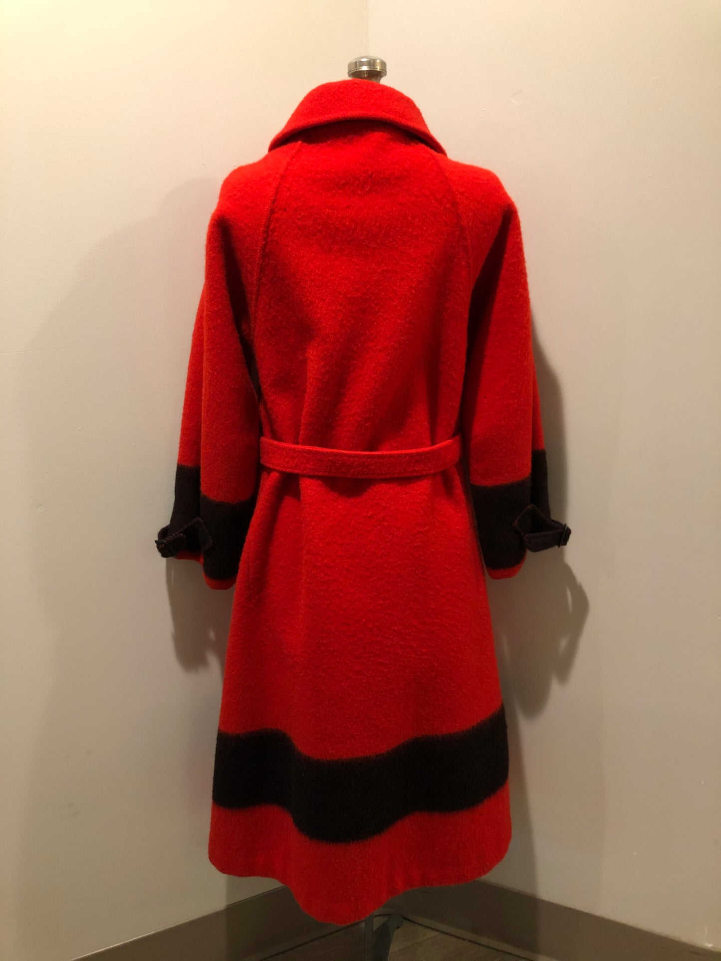 Kingspier Vintage - Hudson’s Bay Company red and black stripe 100% virgin wool point blanket coat in a swing coat style with belt, buckle detail at the collar, button closures, slash pockets and red lining. Size medium/ large.