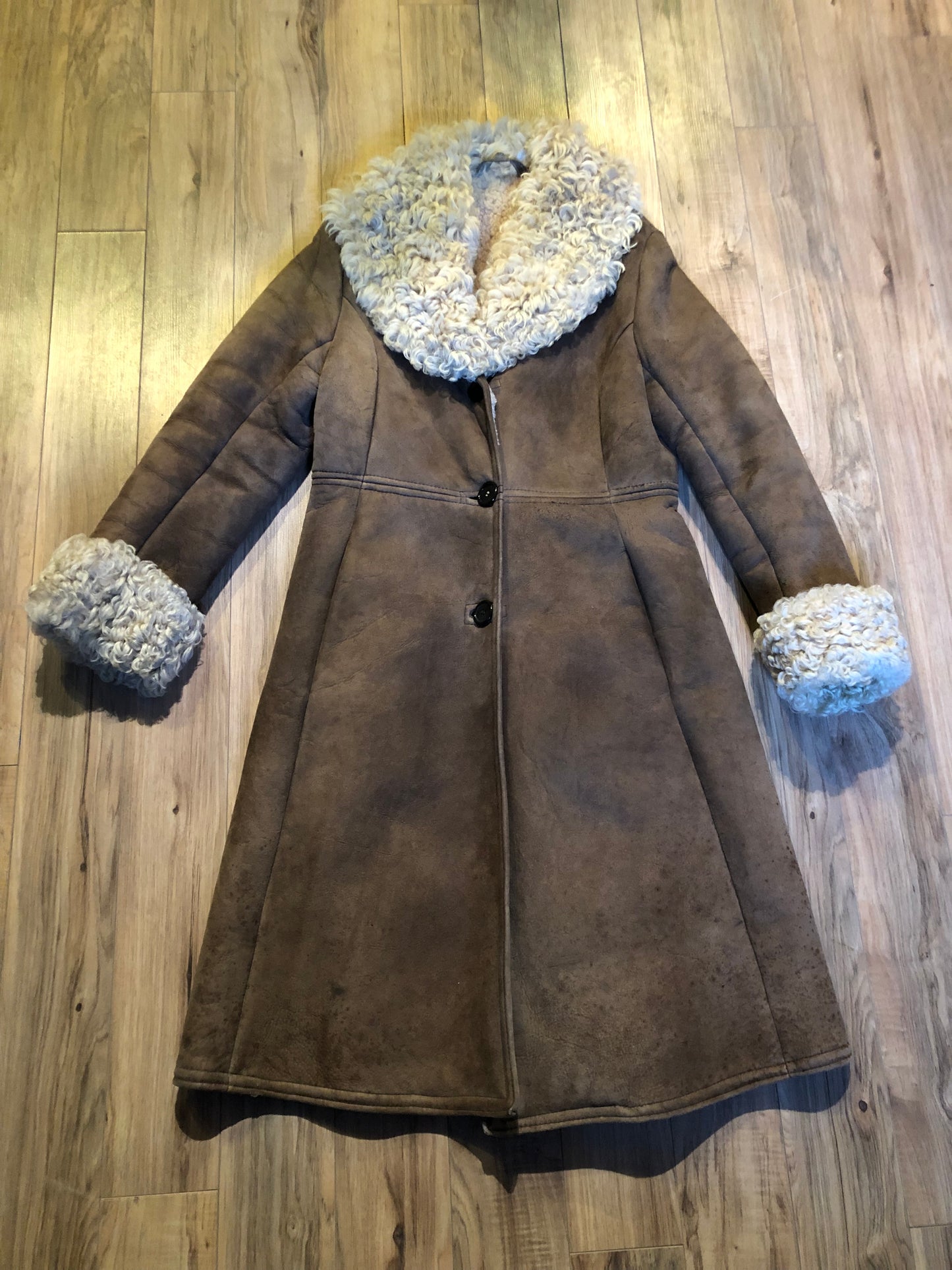 Vintage Antarrex Mongolian lambskin full length shearling coat with button closures and two front pockets.