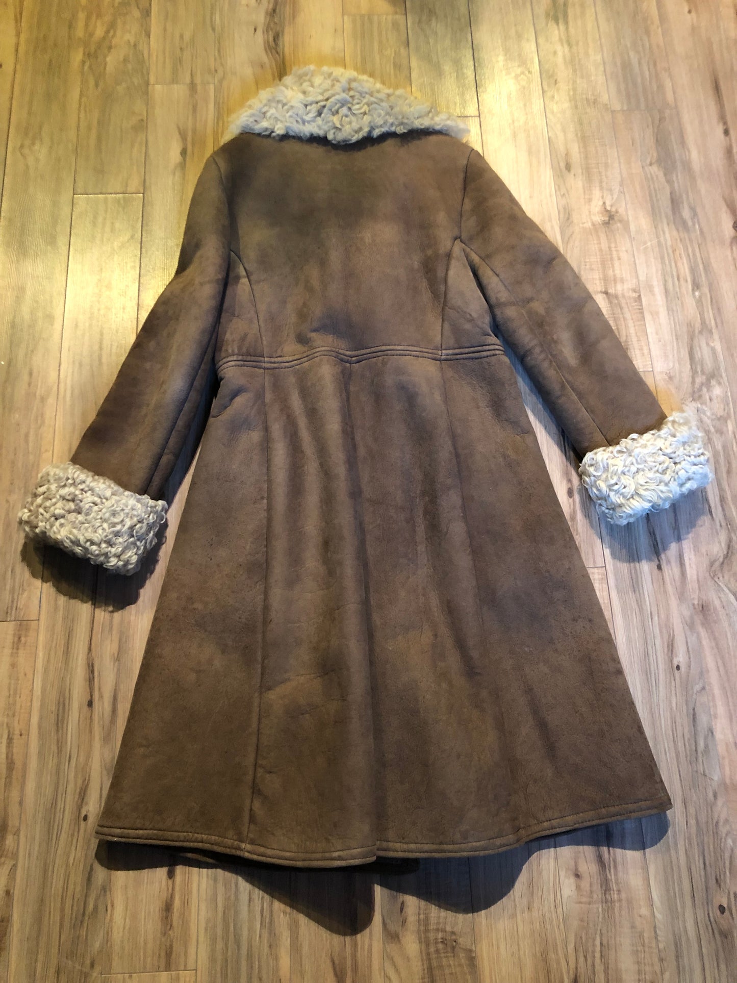 Vintage Antarrex Mongolian lambskin full length shearling coat with button closures and two front pockets.