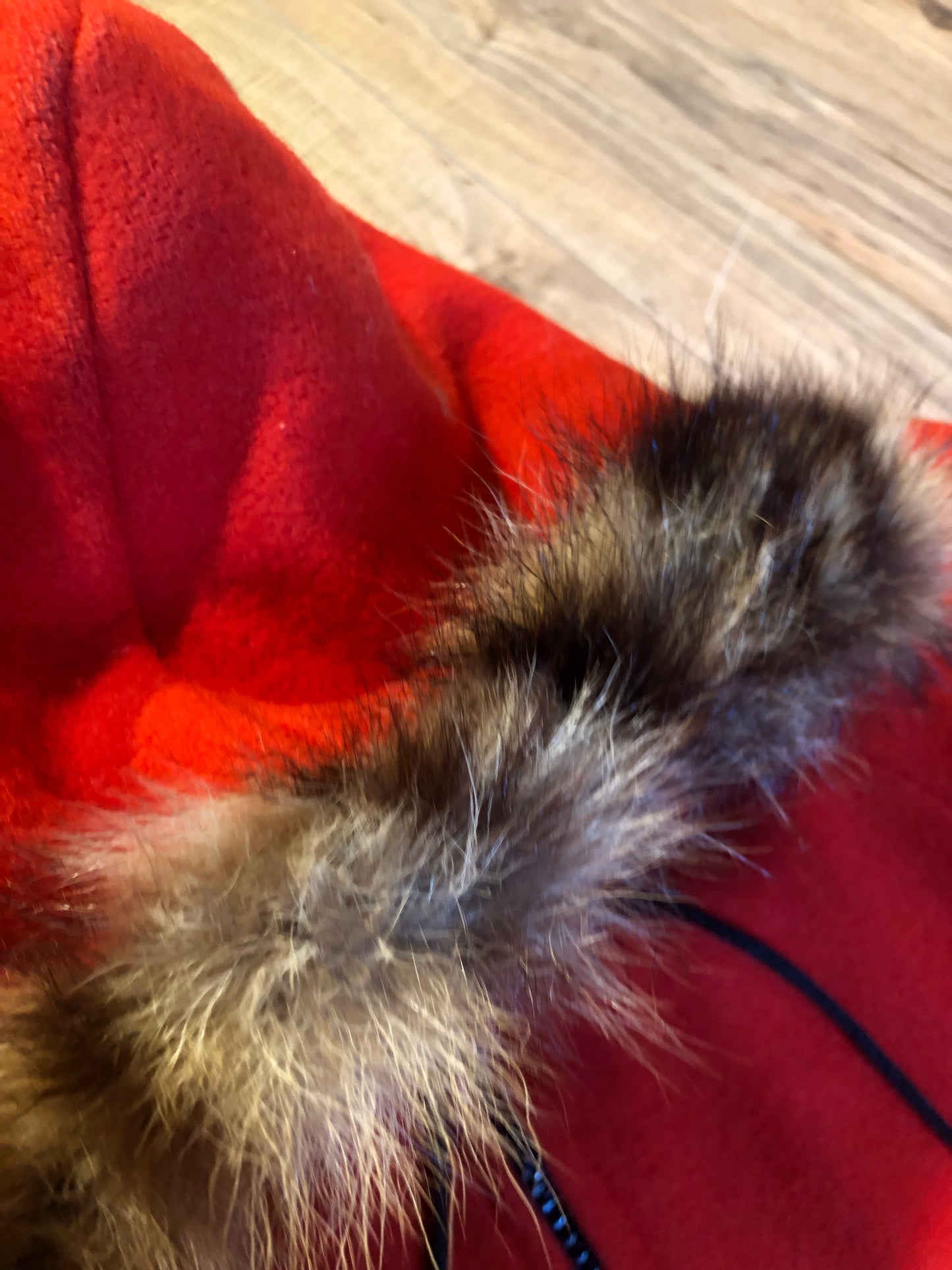 Kingspier Vintage - Vintage James Bay 100% virgin wool northern parka in bright red. This parka features a fur trimmed hood, zipper closure, pockets, quilted lining, storm cuffs, and penguin scene in felt applique. Made in Canada.