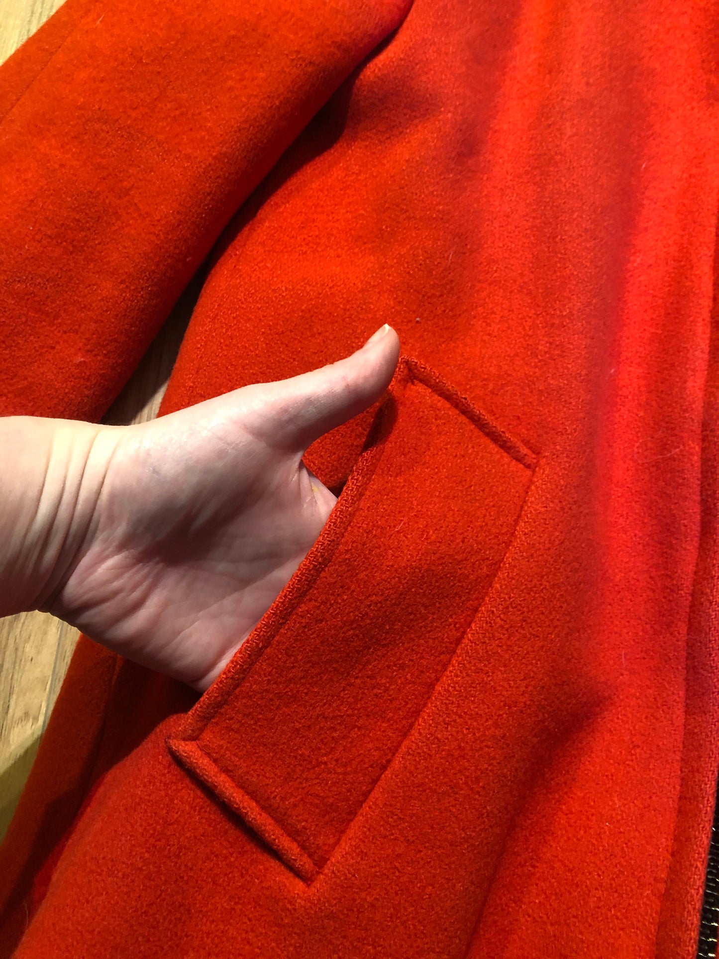 Kingspier Vintage - Vintage James Bay 100% virgin wool northern parka in bright red. This parka features a fur trimmed hood, zipper closure, pockets, quilted lining, storm cuffs, and penguin scene in felt applique. Made in Canada.