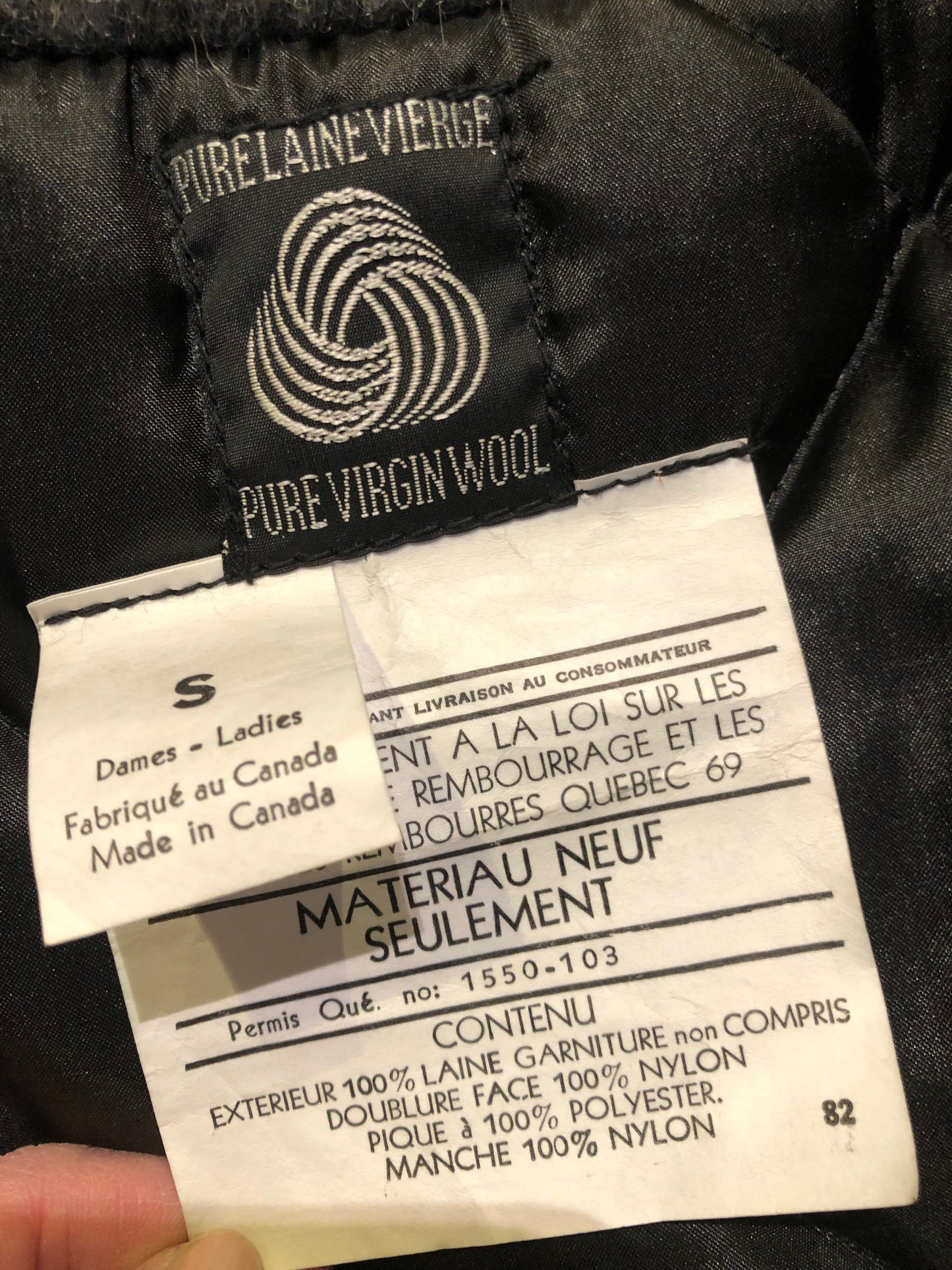 Kingspier Vintage - Vintage James Bay 100% virgin wool northern parka in grey. This parka features a fur trimmed hood, zipper closure, patch pockets, quilted lining, storm cuffs, leather trim, custom embroidery and a beaver design in felt applique.
Made in Canada.
Size small.