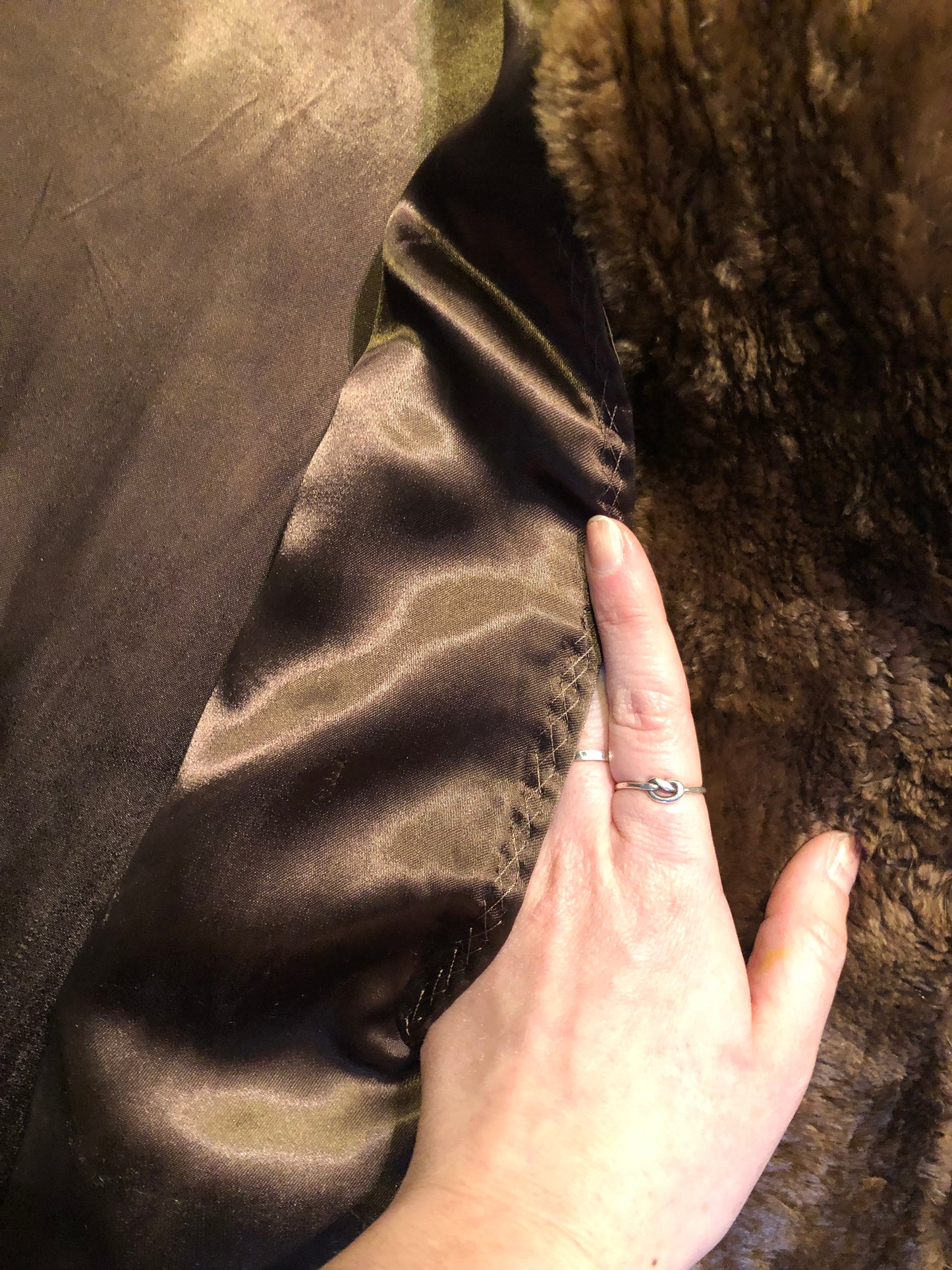 Kingspier Vintage - Vintage Vogue Furriers long fur coat circa 1970’s features leather button closures, two front pockets abd a brown satin lining.
Made in Nova Scotia, Canada.
Size Large.