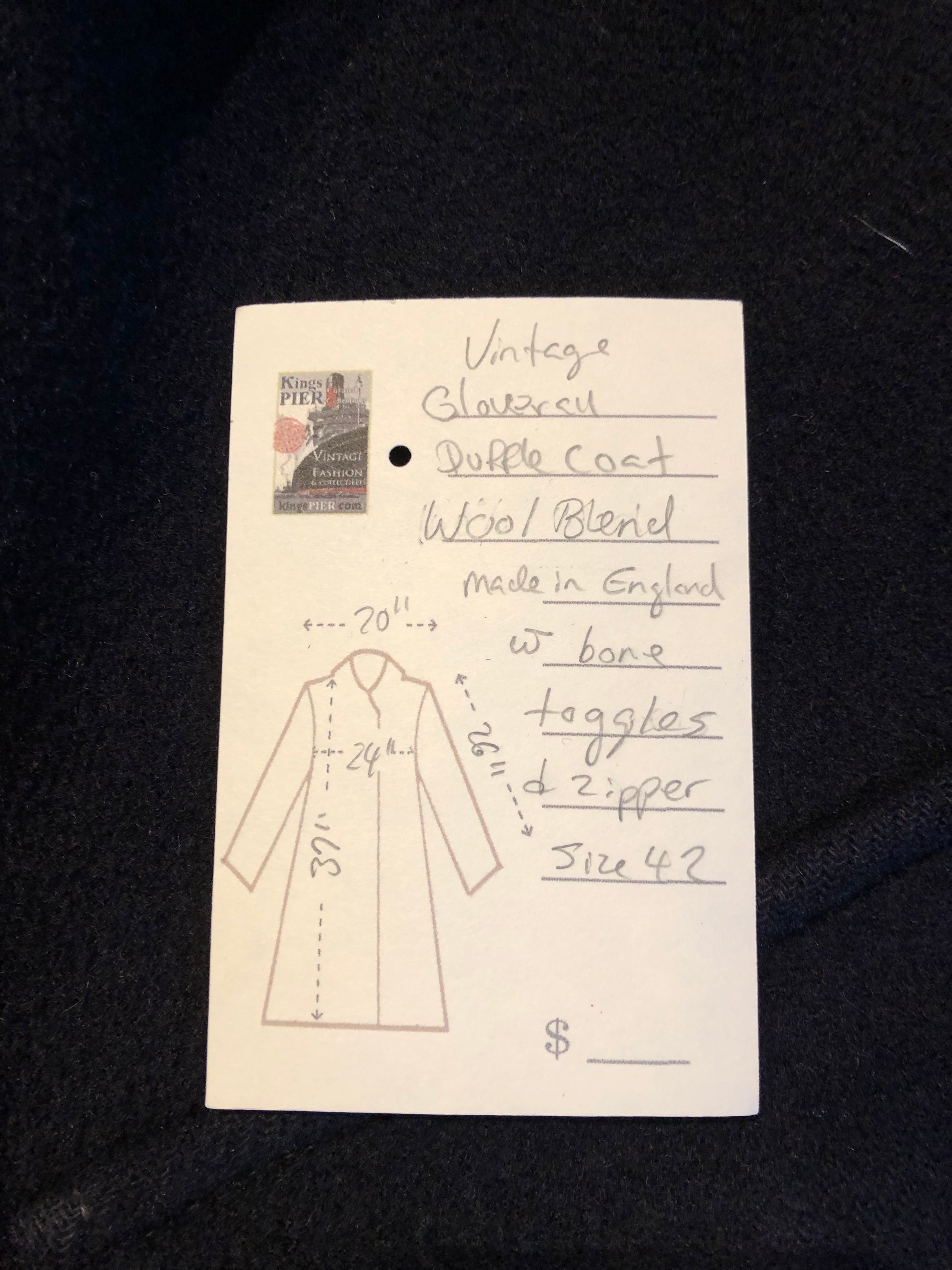 Kingspier Vintage - Vintage Gloverall wool blend duffle coat in navy with zipper and bone toggle closures, flap pockets and a red plaid lining.
Made in England.
Size 42.
Shoulder to shoulder - 20”
Shoulder to wrist - 26”
Armpit to armpit - 24”
Front length - 37”
*All items have been laid flat to measure.
This coat is in great vintage condition with some wear in the cuffs and hem.