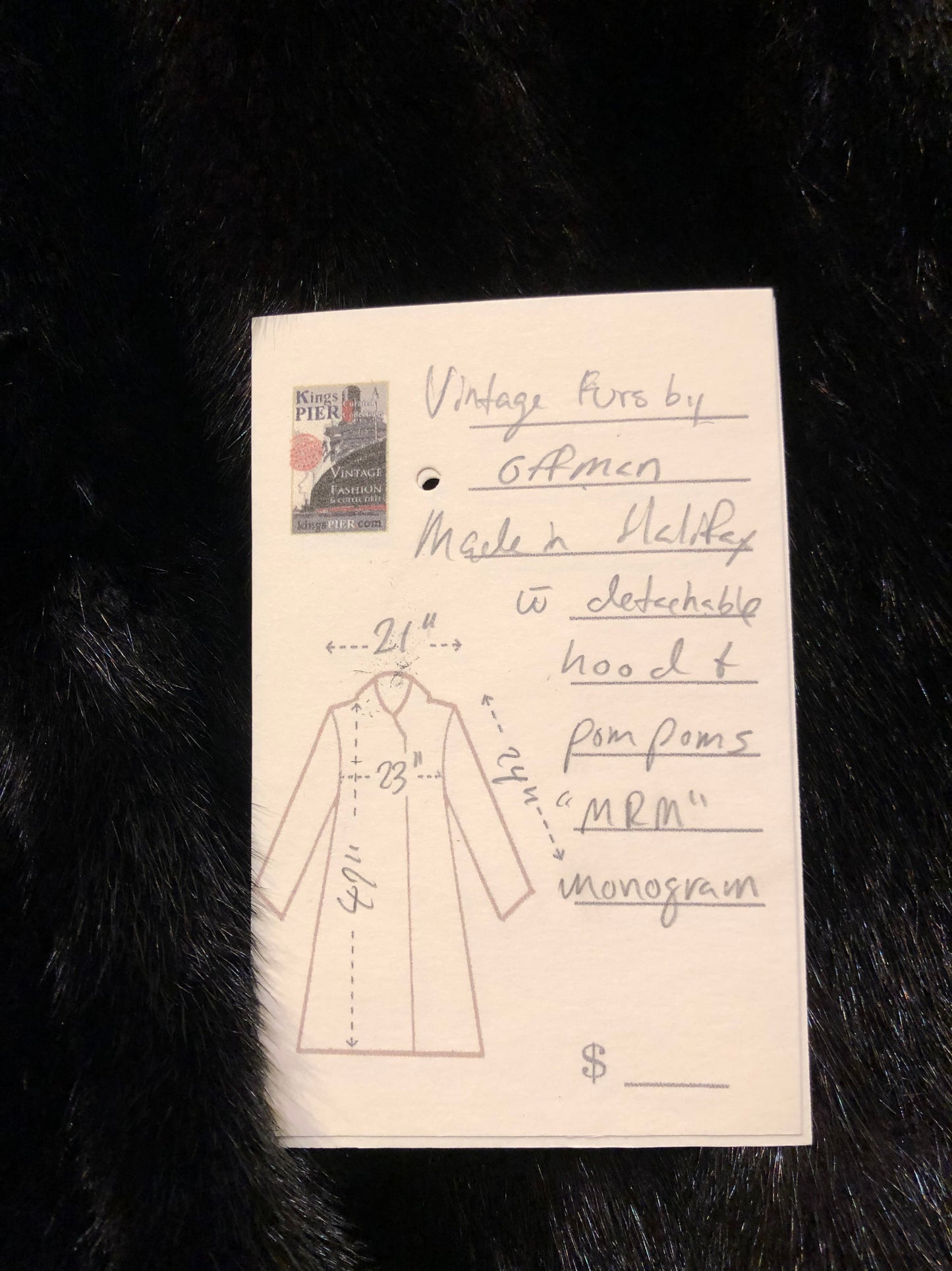 Kingspier Vintage - Vintage Furs by Offerman long fur coat with fur pom poms and a removable hood, hook and eye closures, pockets and an “M.R.M” monogram on the black satin lining.
Made in Nova Scotia, Canada.