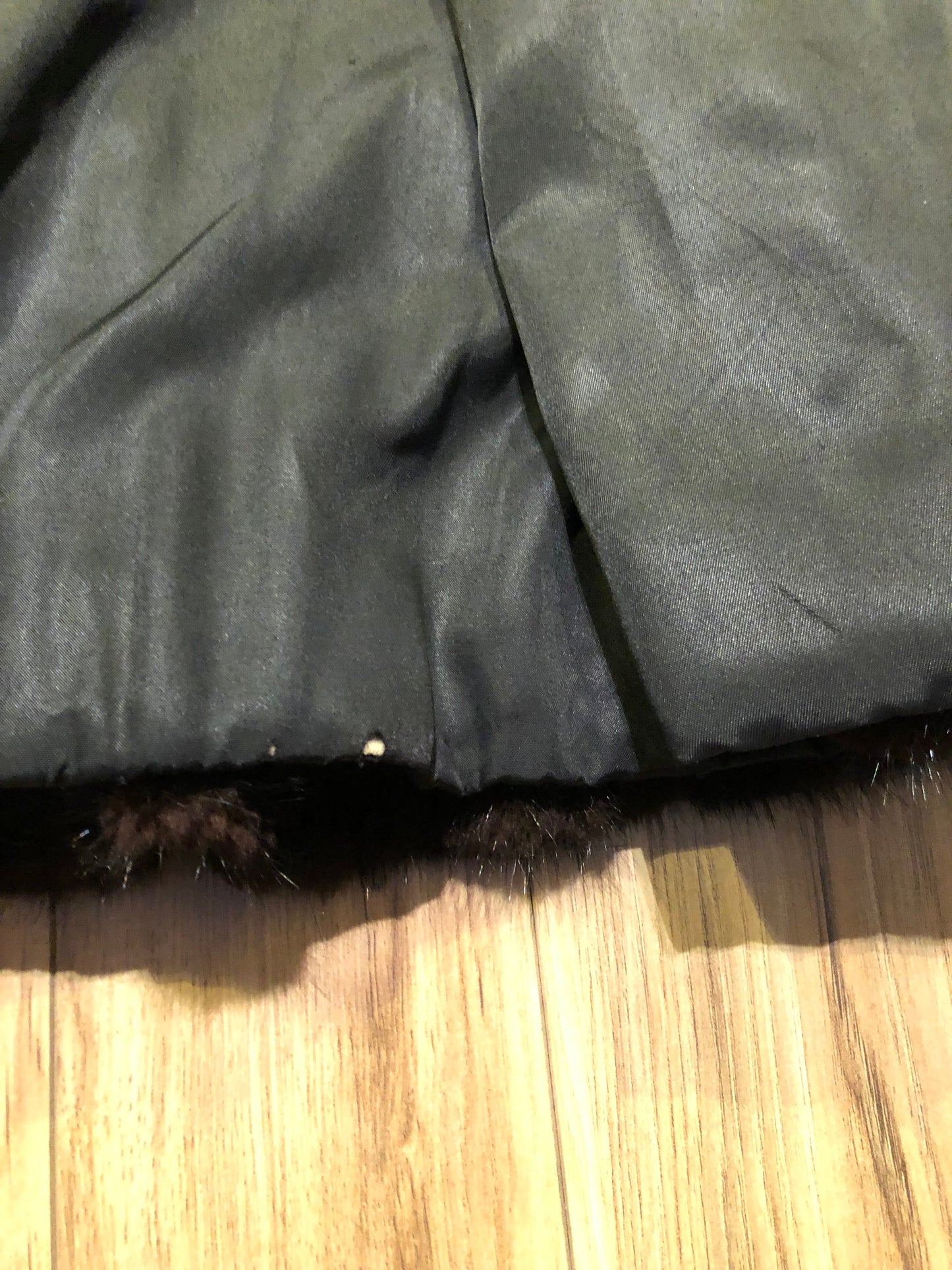 Kingspier Vintage - Vintage Furs by Offerman long fur coat with fur pom poms and a removable hood, hook and eye closures, pockets and an “M.R.M” monogram on the black satin lining.
Made in Nova Scotia, Canada.