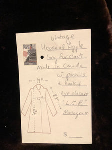 Kingspier Vintage - Vintage House of Apple long fur coat with flared sleeves, hook and eye closures, two front pockets and a “L.C.J.” monogram in the satin lining.