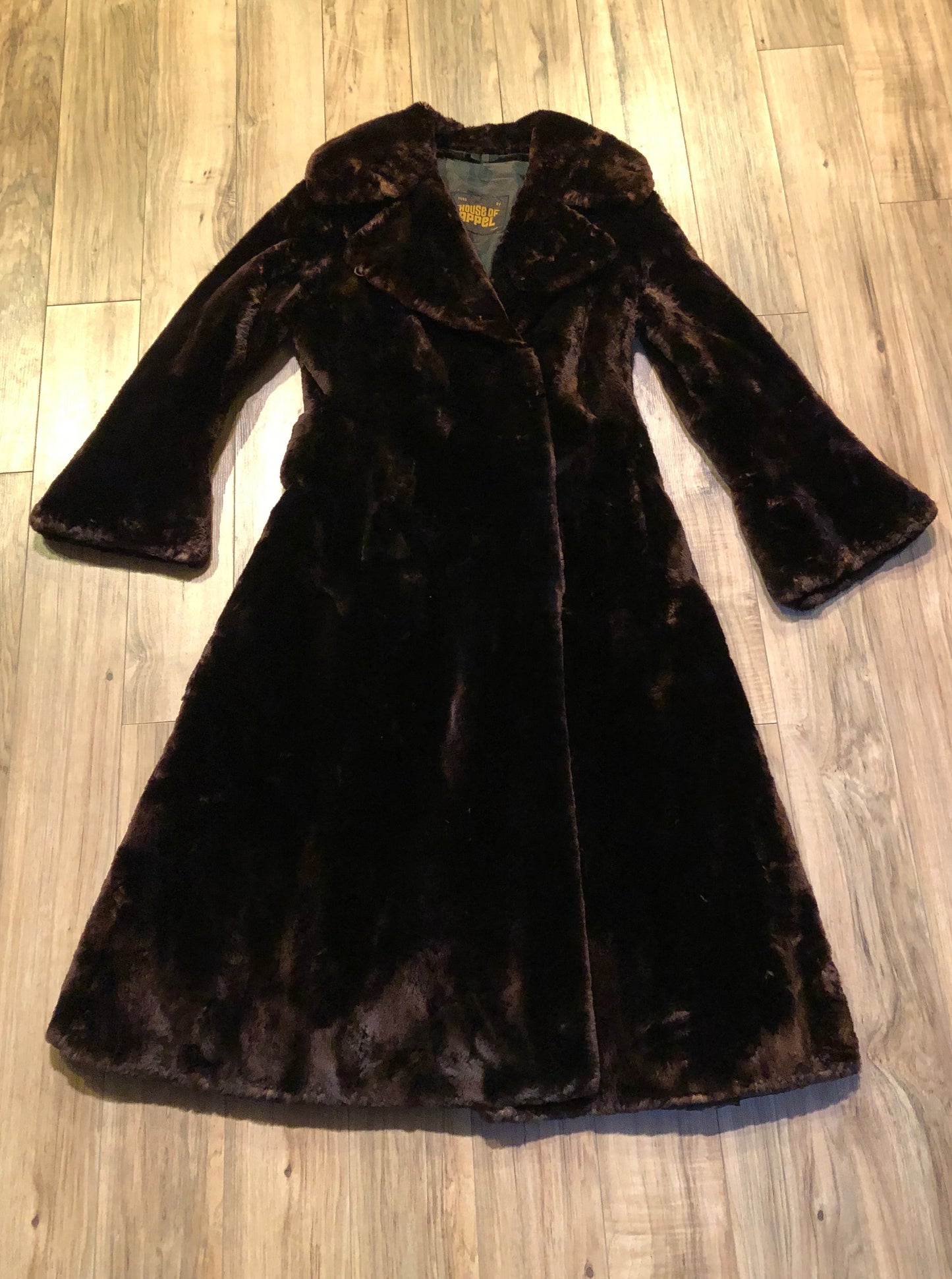 Kingspier Vintage - Vintage House of Apple long fur coat with flared sleeves, hook and eye closures, two front pockets and a “L.C.J.” monogram in the satin lining.