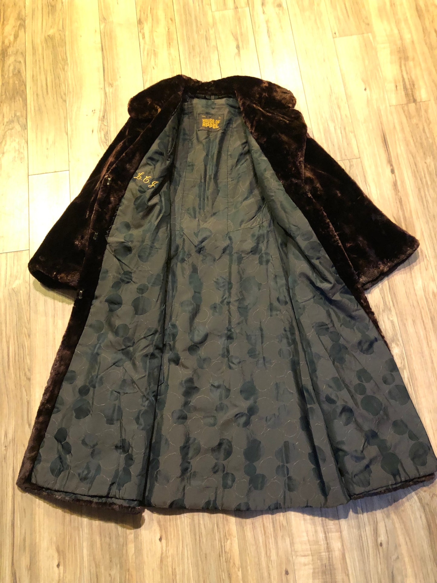 Kingspier Vintage - Vintage House of Apple long fur coat with flared sleeves, hook and eye closures, two front pockets and a “L.C.J.” monogram in the satin lining.