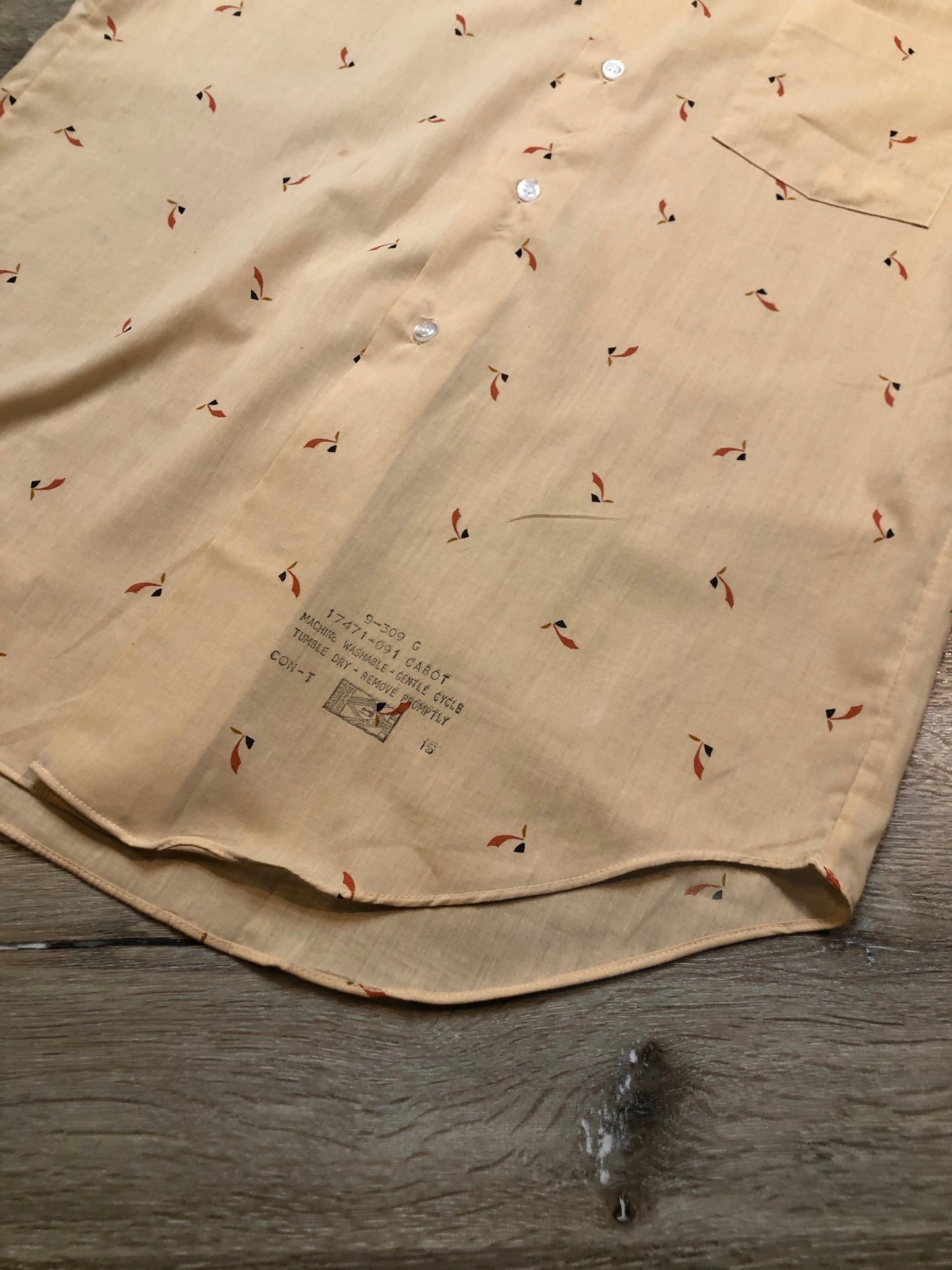 Kingspier Vintage - Vintage Arrow button up shirt in salmon, black, mustard and orange design. Made in Canada. Mens size medium.