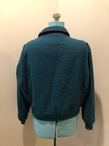 Kingspier Vintage - Vintage Woolrich wool blend bomber style jacket in teal with plaid lining, zipper closure, two front pockets and knit cuffs. The shell is 80% wool/ 20% nylon.

Made in USA
Size Large
