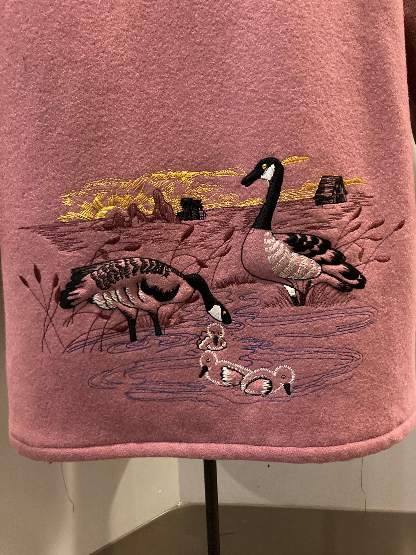 Kingspier Vintage - Vintage Northern Sun light pink 100% wool parka features a removable storm shell, fur trimmed hood, fur pom poms, zipper closures, two front pockets, quilted lining and hand embroidered goose motif on the front, and back of the coat.
Made in Canada.
Size 16/ Large.