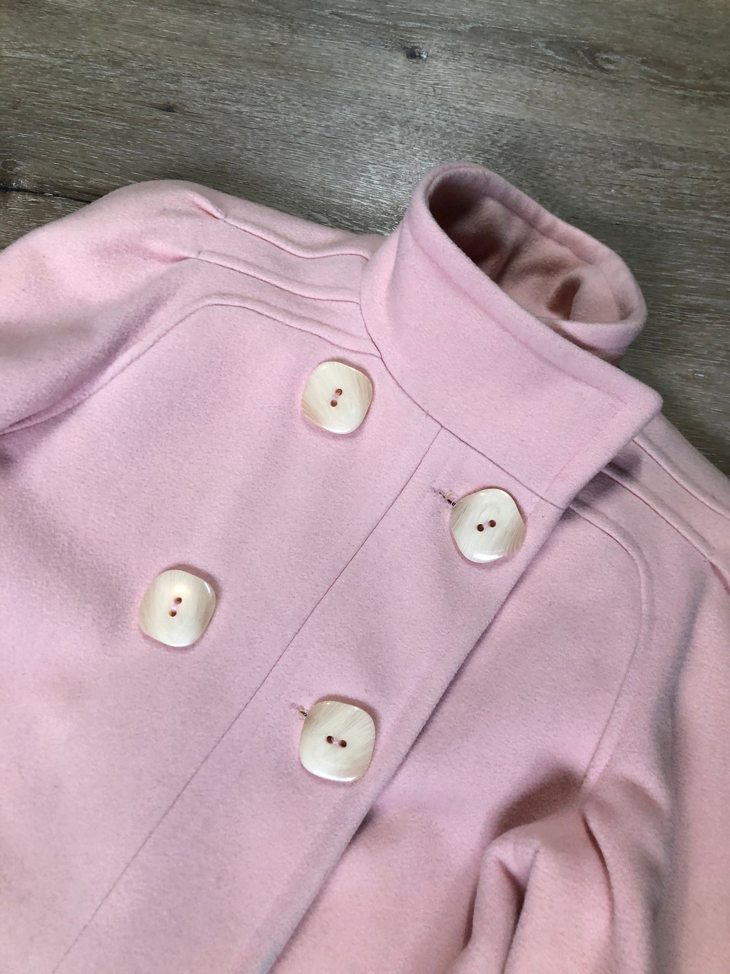 Kingspier Vintage - Novelti pink 100% wool double breasted coat with pleating detail in shoulders, cuffed sleeves, button and snap closures and vertical pockets. Made in Canada. Size small.