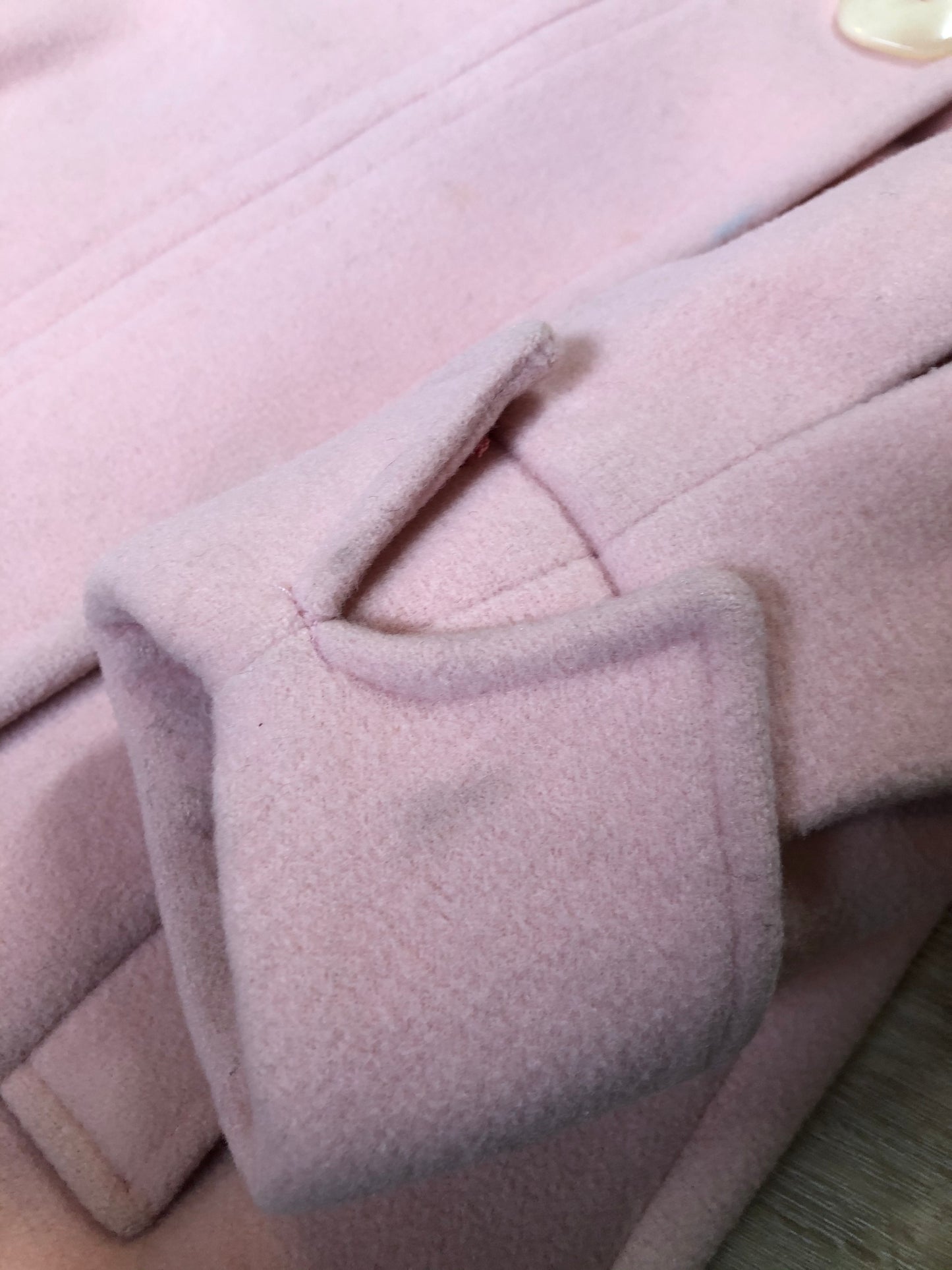 Kingspier Vintage - Novelti pink 100% wool double breasted coat with pleating detail in shoulders, cuffed sleeves, button and snap closures and vertical pockets. Made in Canada. Size small.