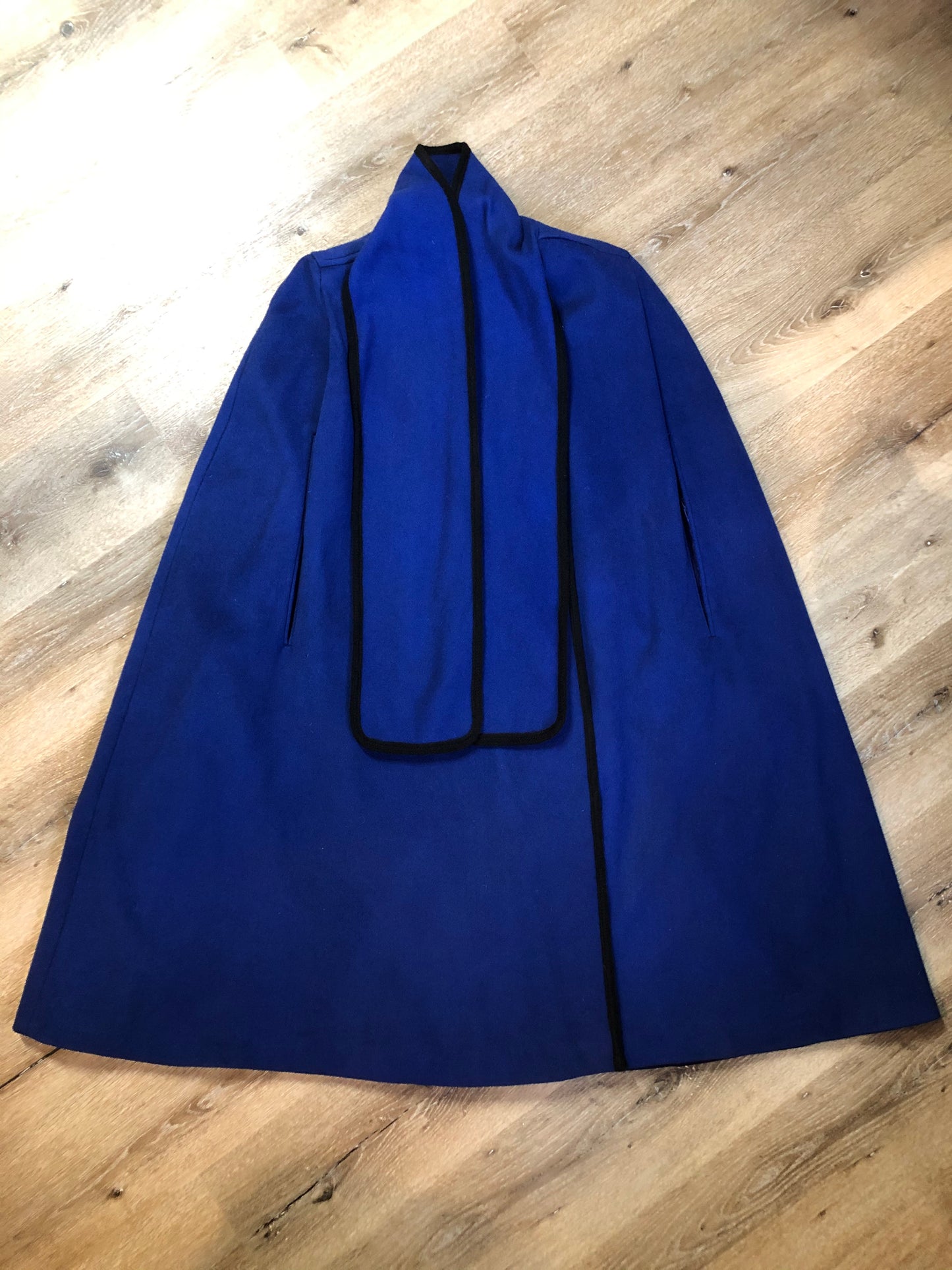 Kingspier Vintage - Alorna royal blue 100% wool cape with arm slits, attached scarf, satin like lining and inside pockets. Union made in USA.