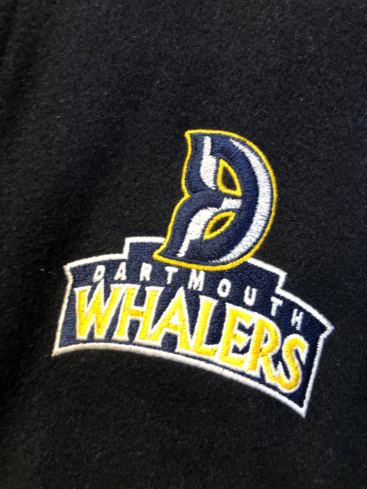 Kingspier Vintage - Dartmouth Whalers navy blue wool blend with leather trim varsity jacket. Jacket features Dartmouth whalers emblem on the chest and the back, “defence” embroidered on the left sleeve and “Forbes” embroidered on the right sleeve, insulated lining, two inside pockets, two slash pockets, zipper and snap closures. Made by Canada sportswear. Size small.