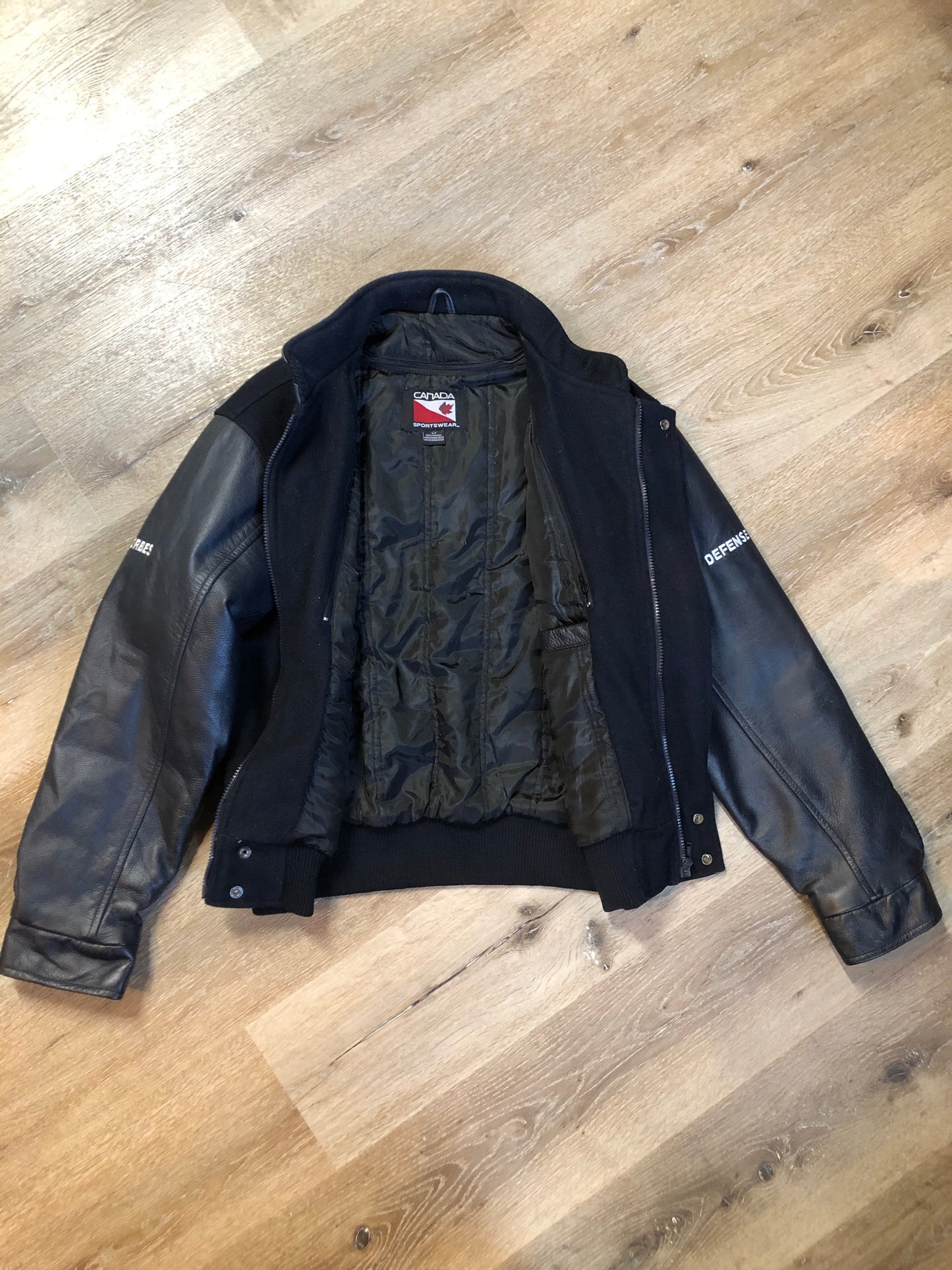 Kingspier Vintage - Dartmouth Whalers navy blue wool blend with leather trim varsity jacket. Jacket features Dartmouth whalers emblem on the chest and the back, “defence” embroidered on the left sleeve and “Forbes” embroidered on the right sleeve, insulated lining, two inside pockets, two slash pockets, zipper and snap closures. Made by Canada sportswear. Size small.